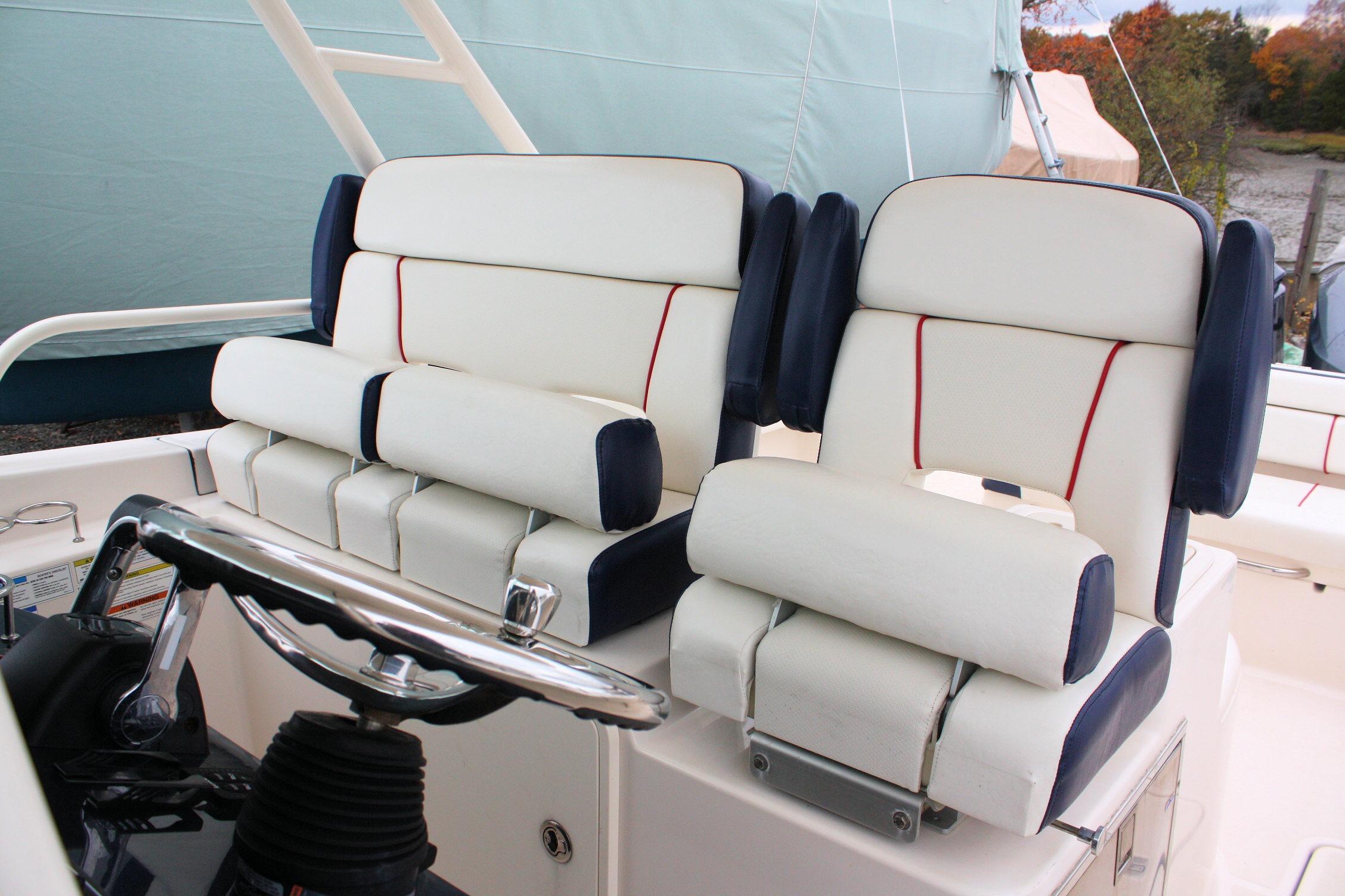 2013 Pursuit ST 310 Sport boat seats with white and navy upholstery.