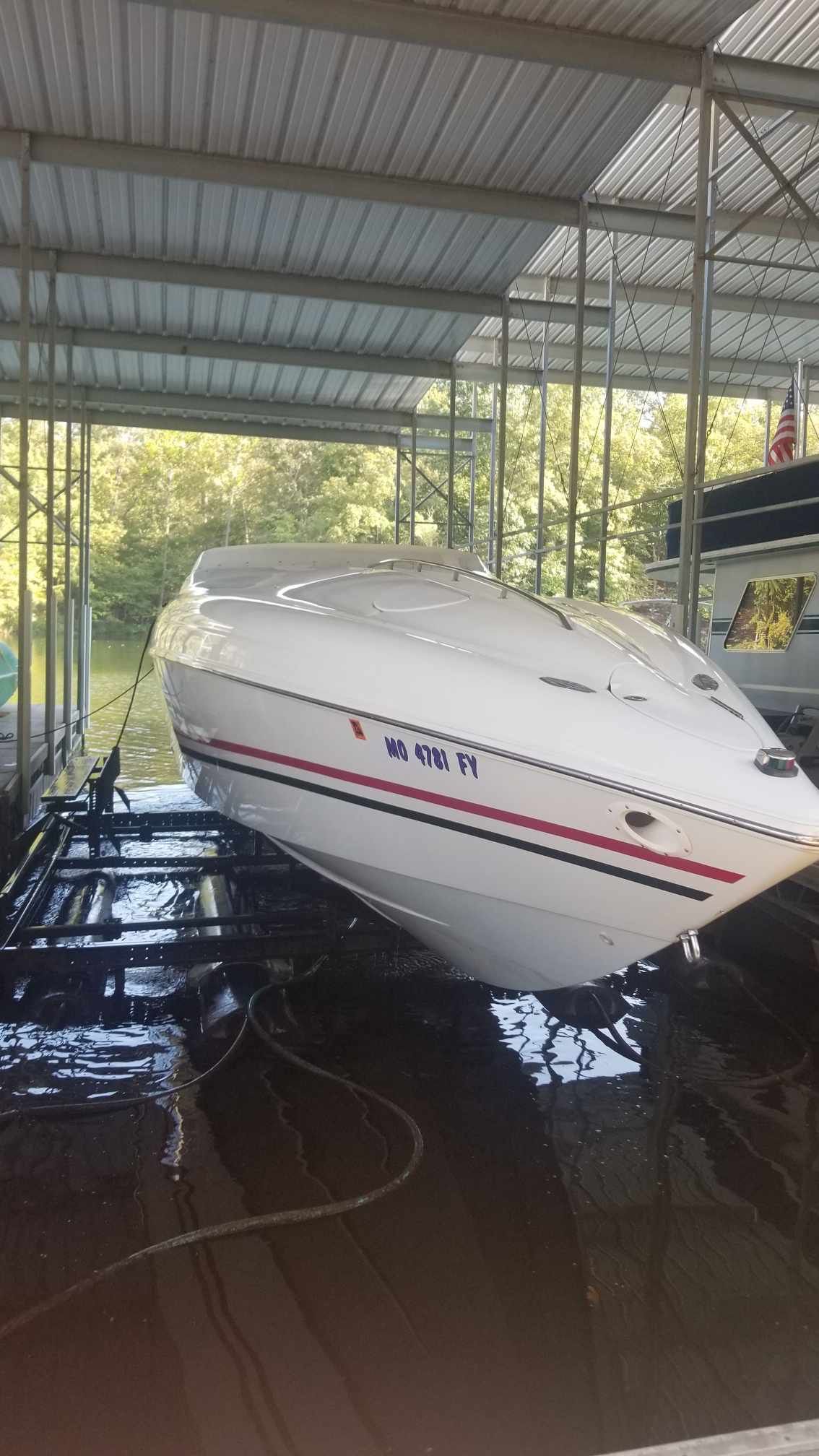 1997 Baja 38 Special Boss boat in dock.