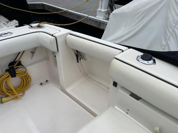 2003 Tiara Yachts 3500 Open interior with white seating and docked at marina.