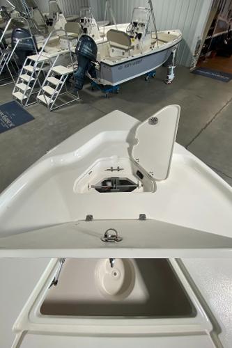 2024 Key West 250 Bay Reef boat interior with open storage compartment.