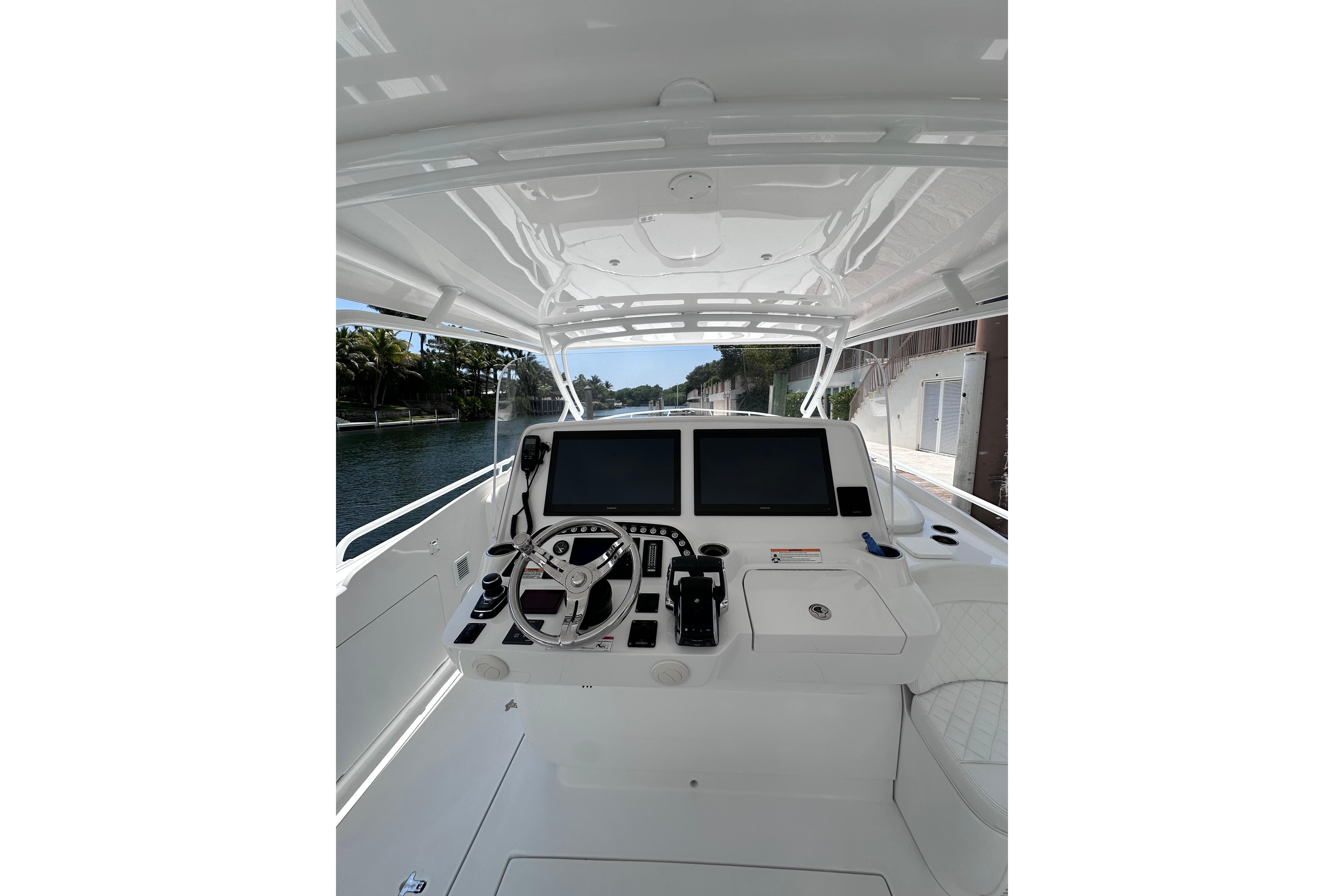 2024 Intrepid 41 Valor boat helm with dual screens and steering wheel.