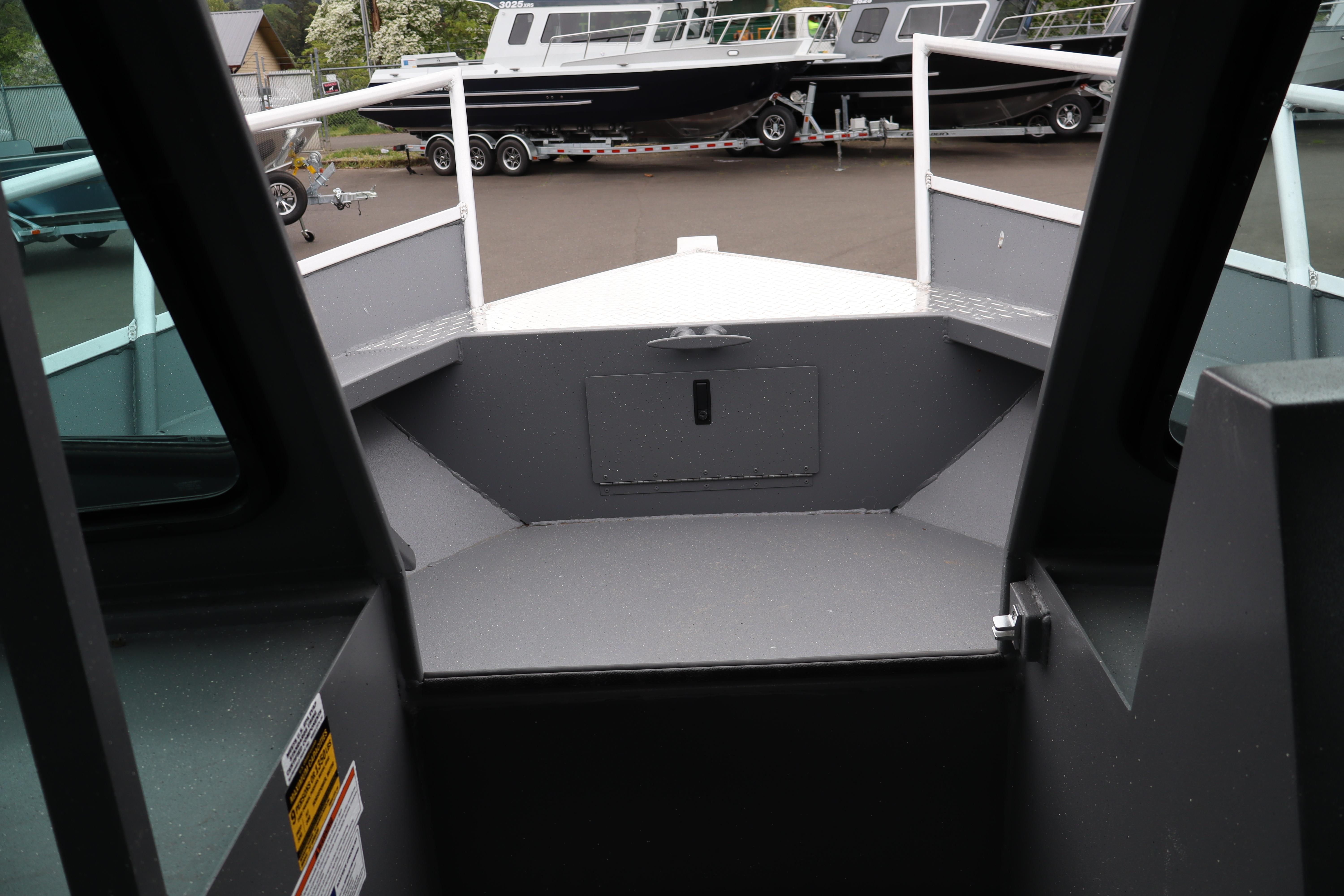 2026 Alumaweld Horizon 24 boat interior, showcasing bow area and deck details.