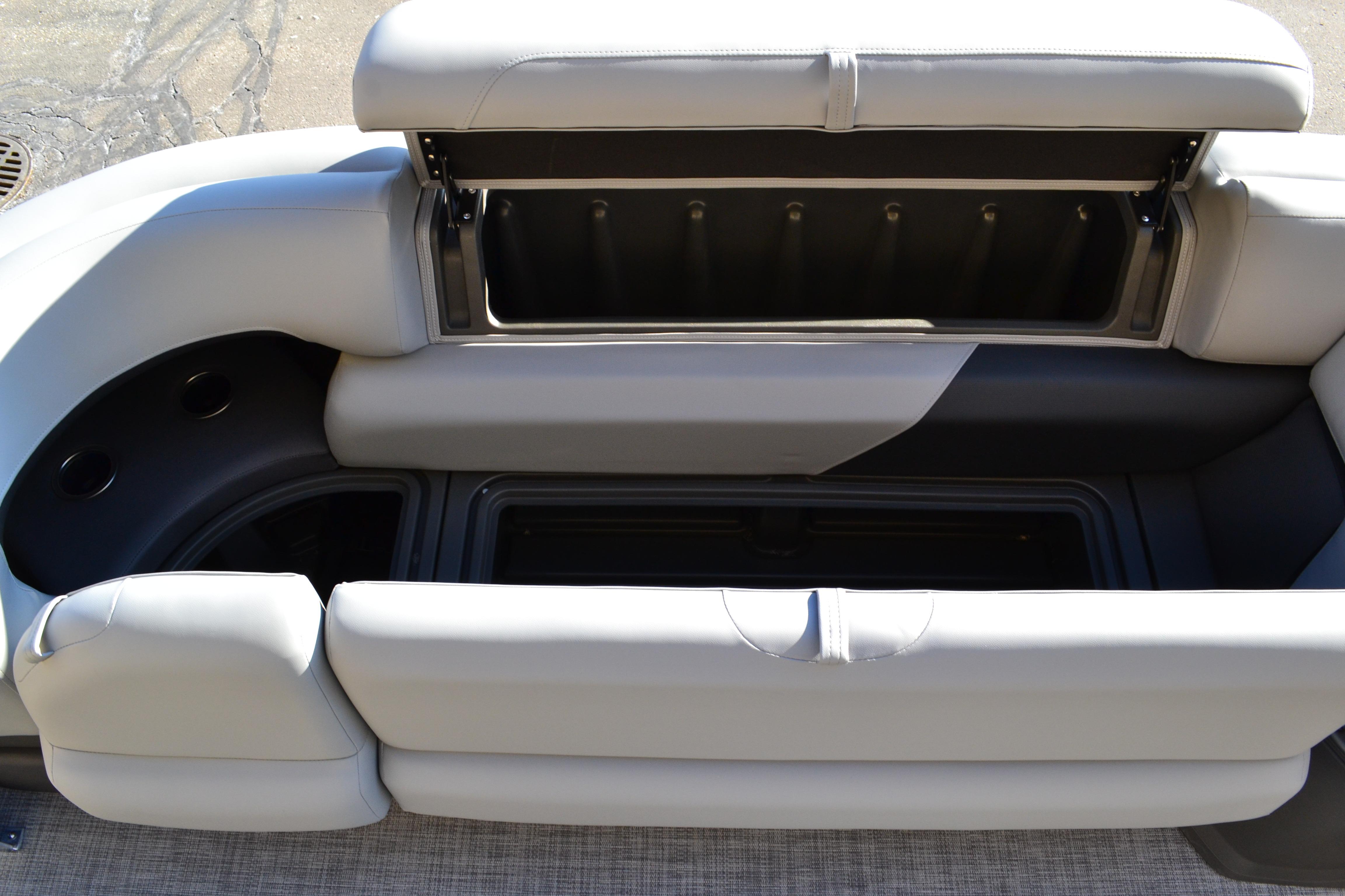 2026 Sun Tracker SportFish 22 XP3 boat seat with open storage compartment.