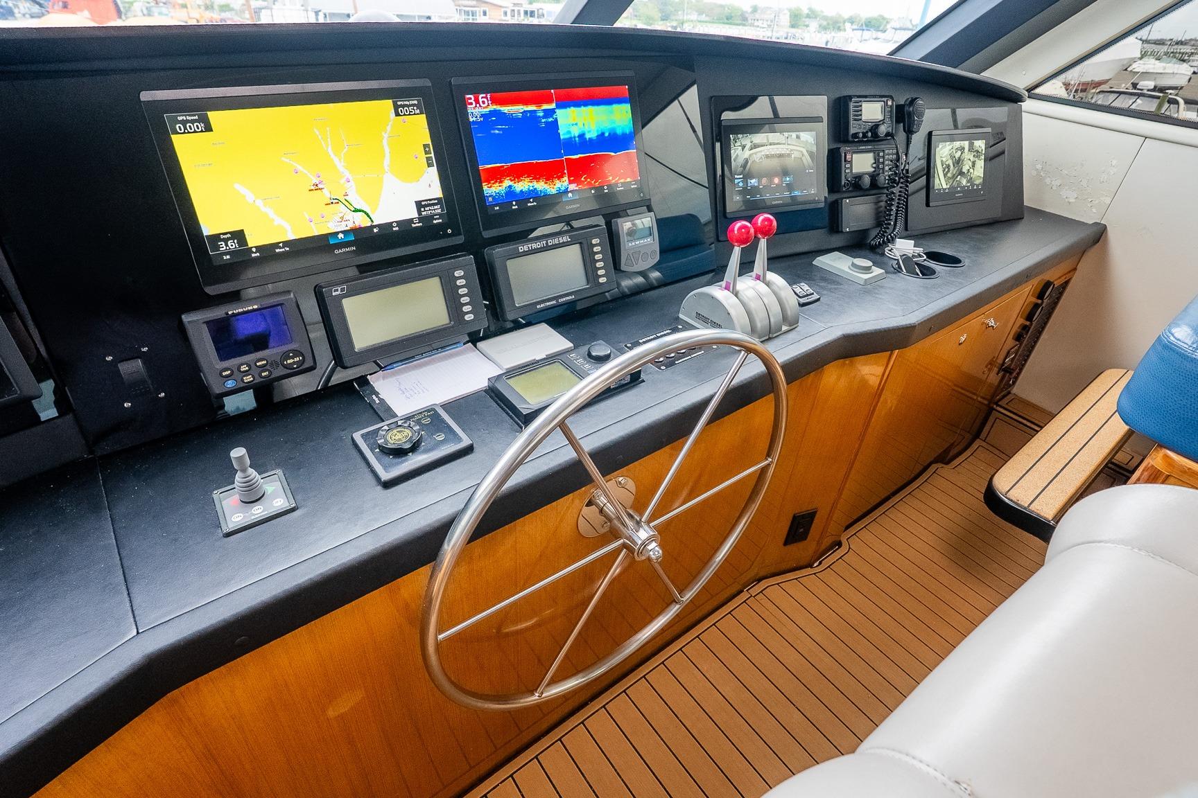 Control panel of 2002 Viking 61 Enclosed Bridge yacht with navigation equipment.