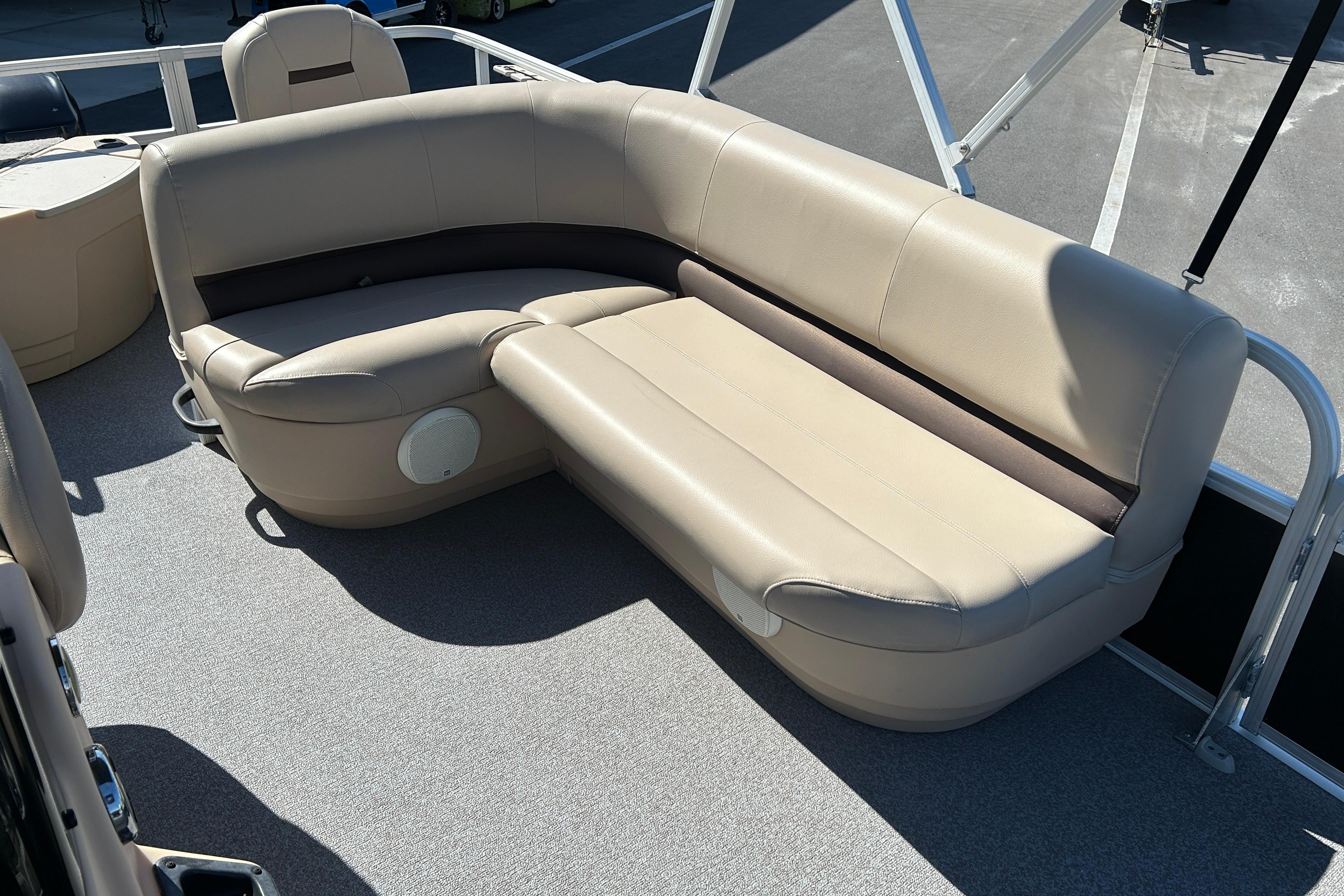 2017 Sun Tracker Bass Buggy 18 DLX pontoon boat with beige seating and spacious deck.