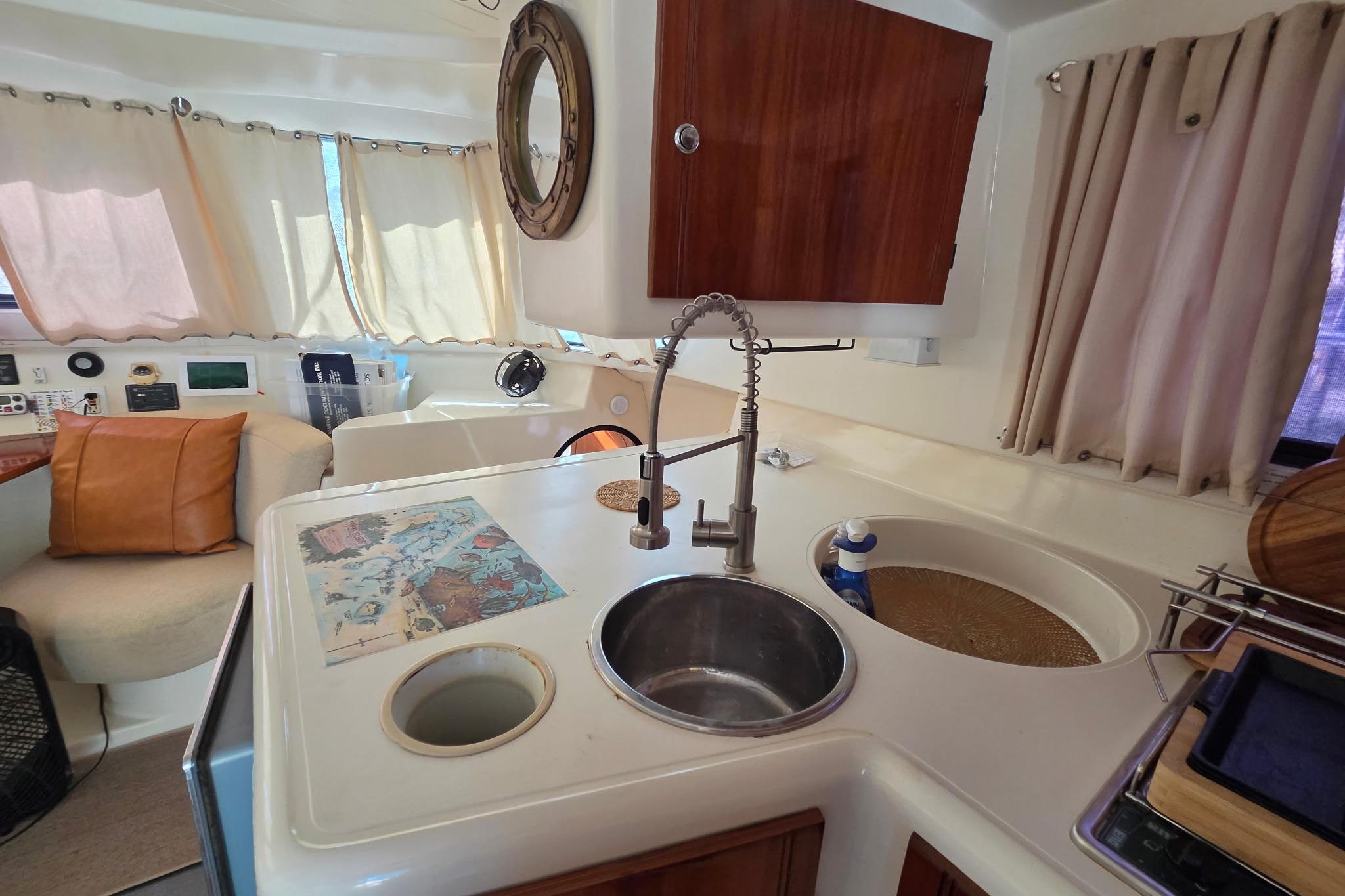 Interior of 2000 Fountaine Pajot Maryland 37 yacht with kitchen and seating area.