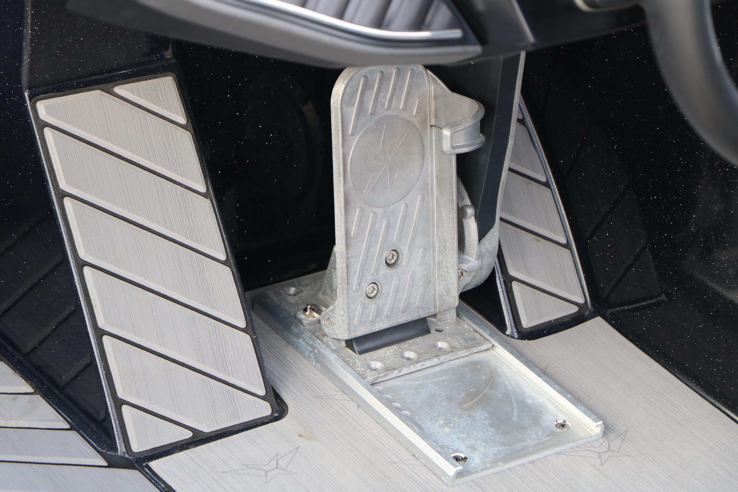 Foot pedal of 2022 Vexus VX21 boat, featuring sleek design and textured surface.