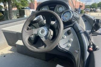 2019 Tracker Pro Team 190 TX boat dashboard with steering wheel and gauges.