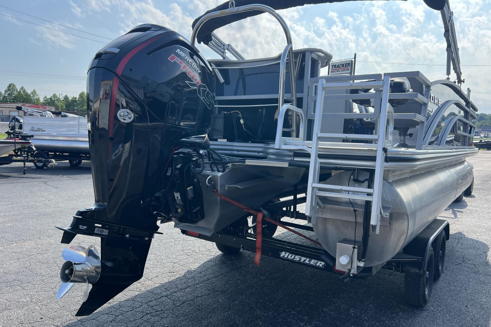 2024 Lowe SF 214 Sport Fish pontoon boat with powerful Mercury Pro XS outboard engine.