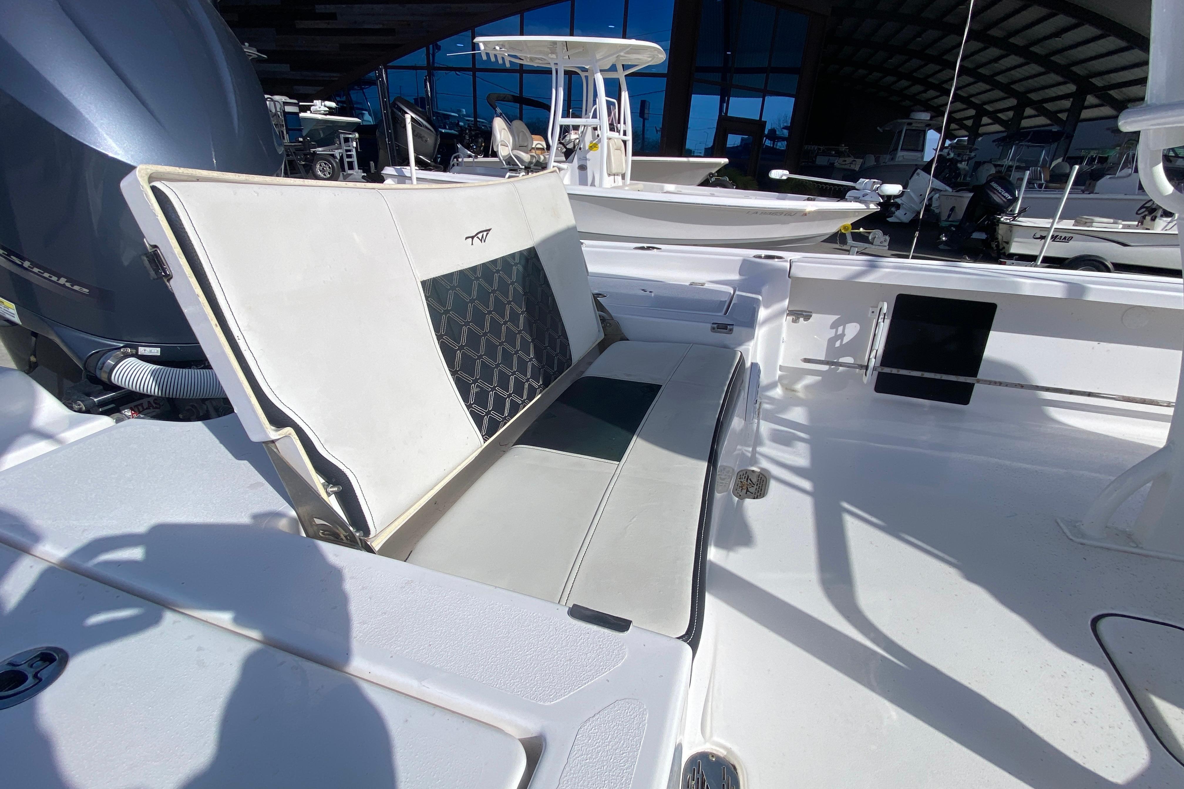 2023 Tidewater 2410 Bay Max boat interior with cushioned seating and modern design.