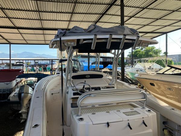 2006 Grady-White Bimini 306 boat in covered storage, surrounded by other vessels.