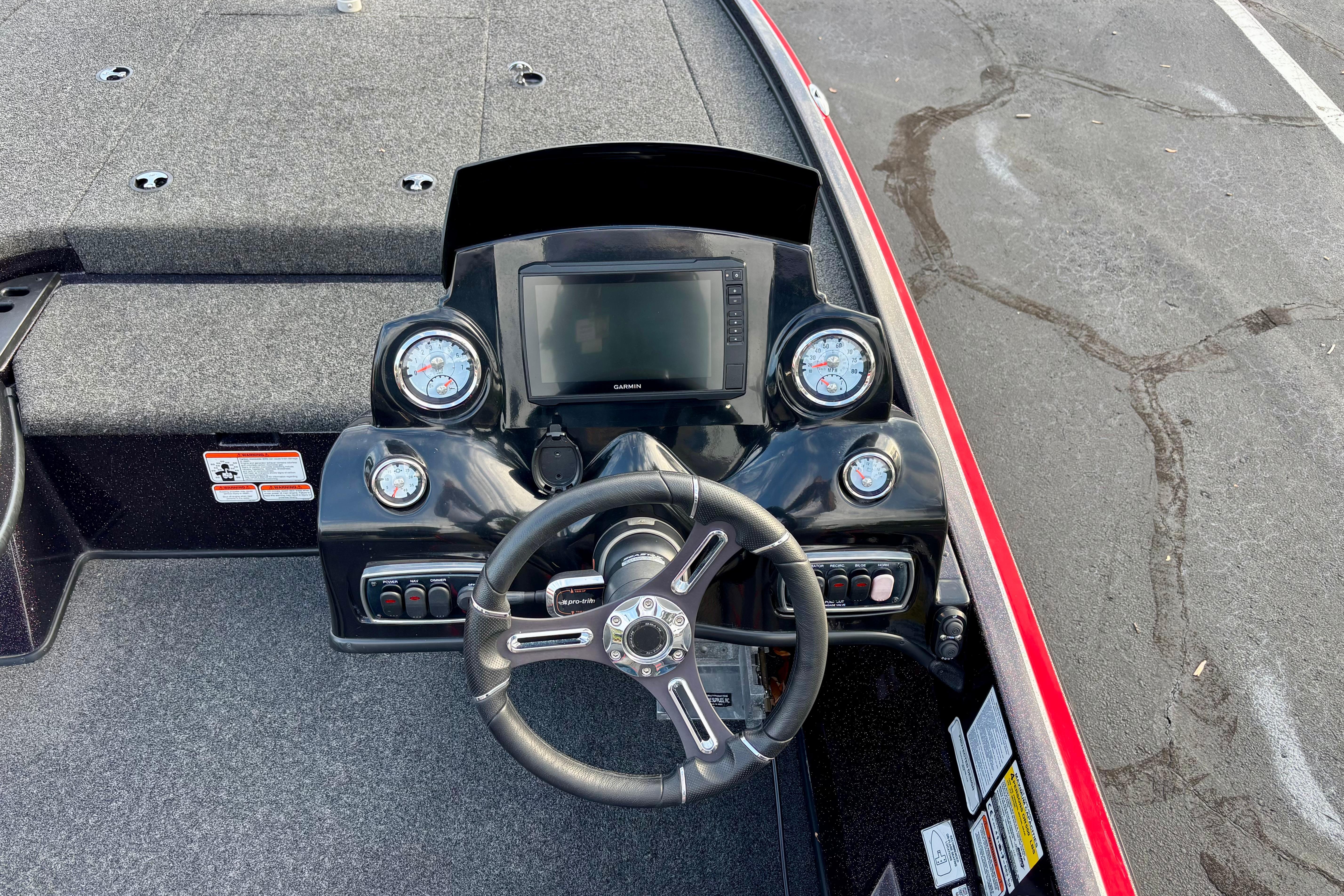 Steering console of a 2018 Nitro Z18 boat with gauges and Garmin display.