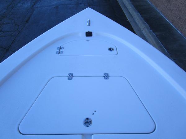 2025 Sea Pro 230 Bay boat deck with storage compartments.