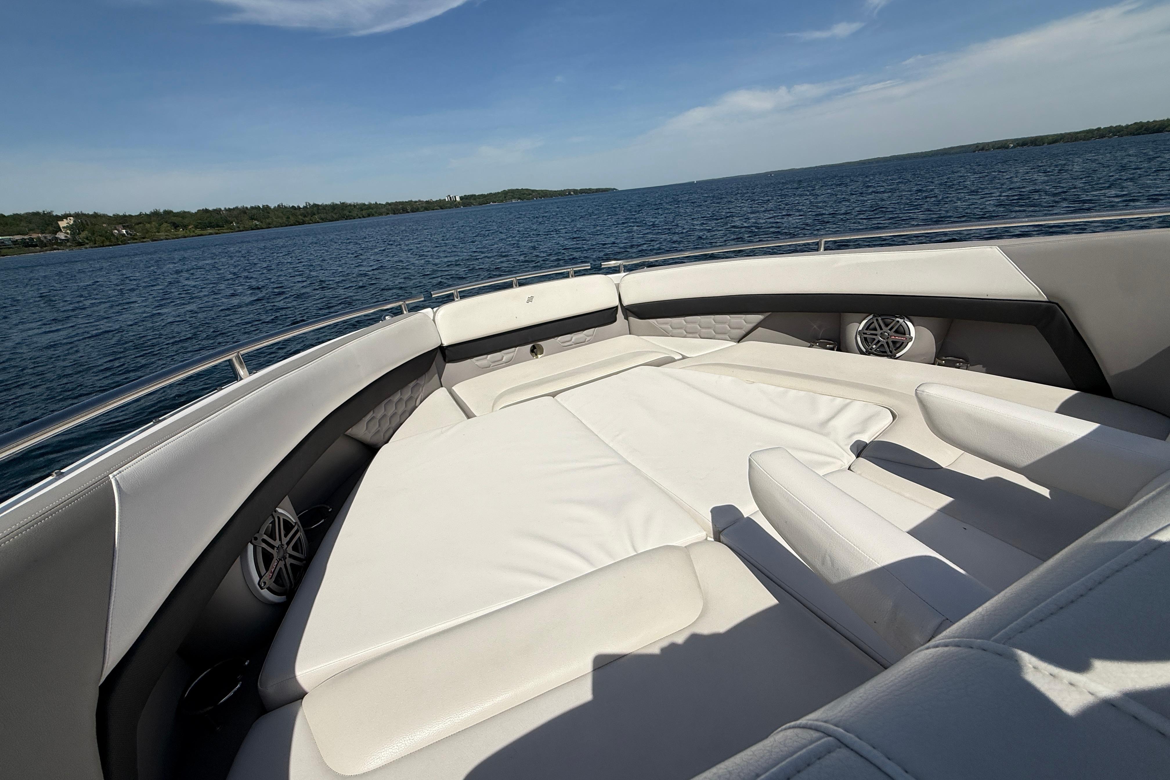 2018 Four Winns H350 boat interior with luxurious seating on a sunny day.