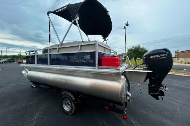 2026 Sun Tracker Bass Buggy 18 DLX pontoon boat with Mercury outboard motor and canopy.