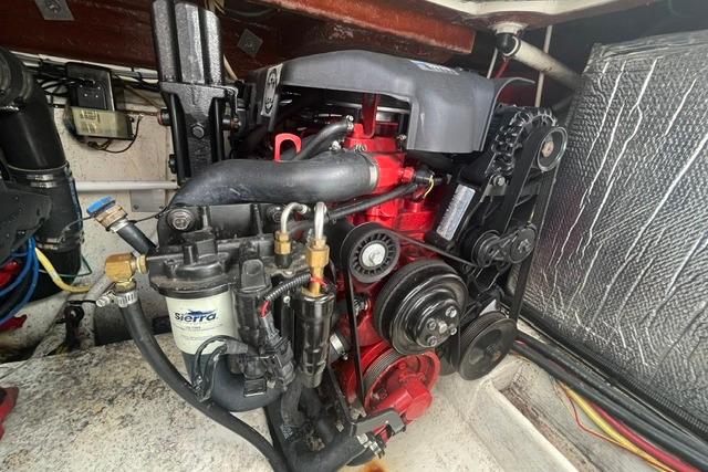 Engine compartment of a 2004 Cruisers Yachts 3372 Express, showcasing mechanical components.