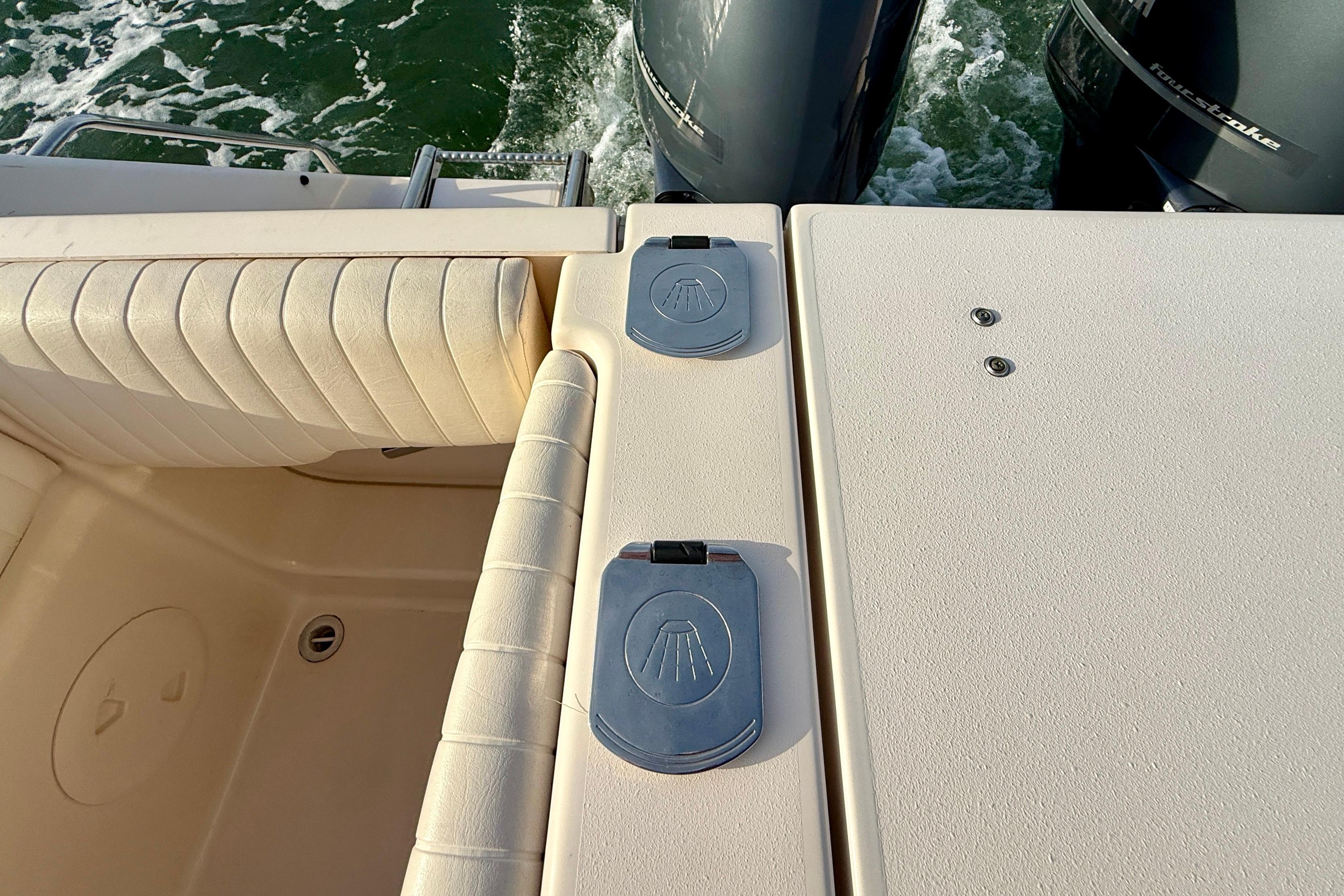 2012 Grady-White Canyon 336 boat deck with twin outboard motors.