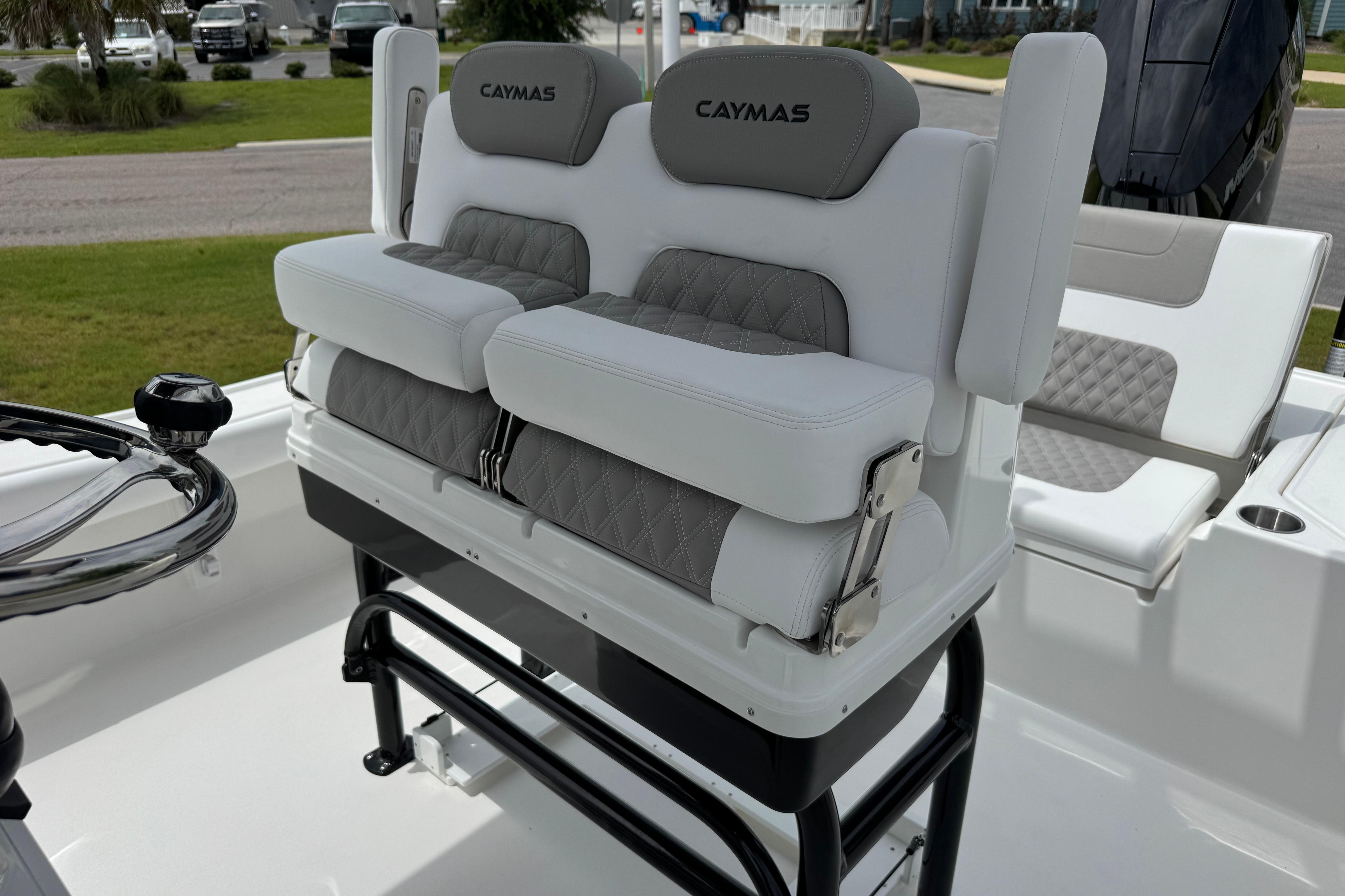 2027 Caymas 26 HB boat seating with cushioned backrests and sleek design.