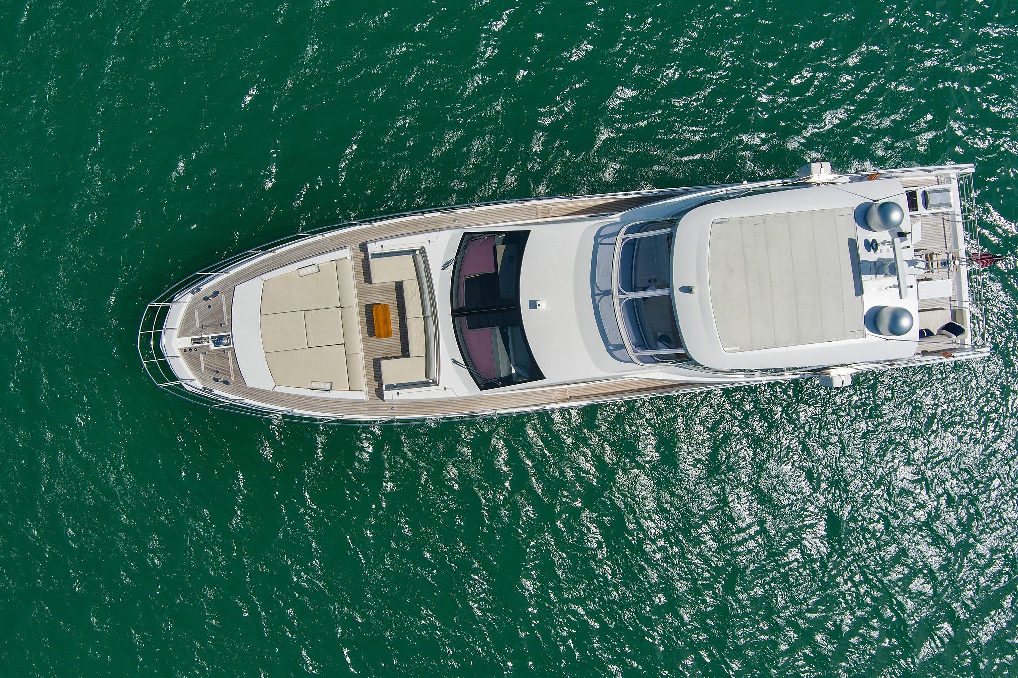 Aerial view of 2017 Azimut 72 Flybridge yacht on turquoise water.