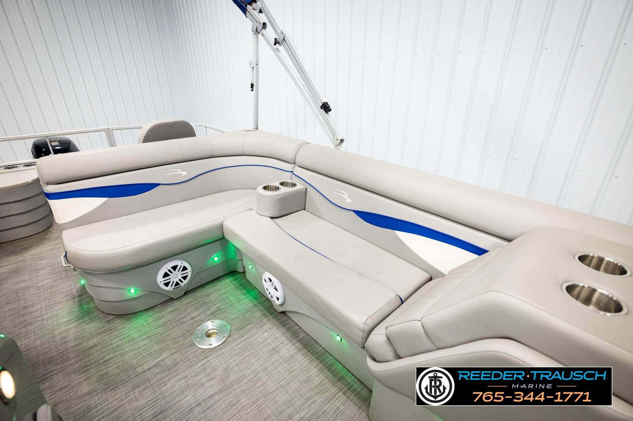 2021 Bennington 20 SV pontoon boat interior with plush seating and cup holders.