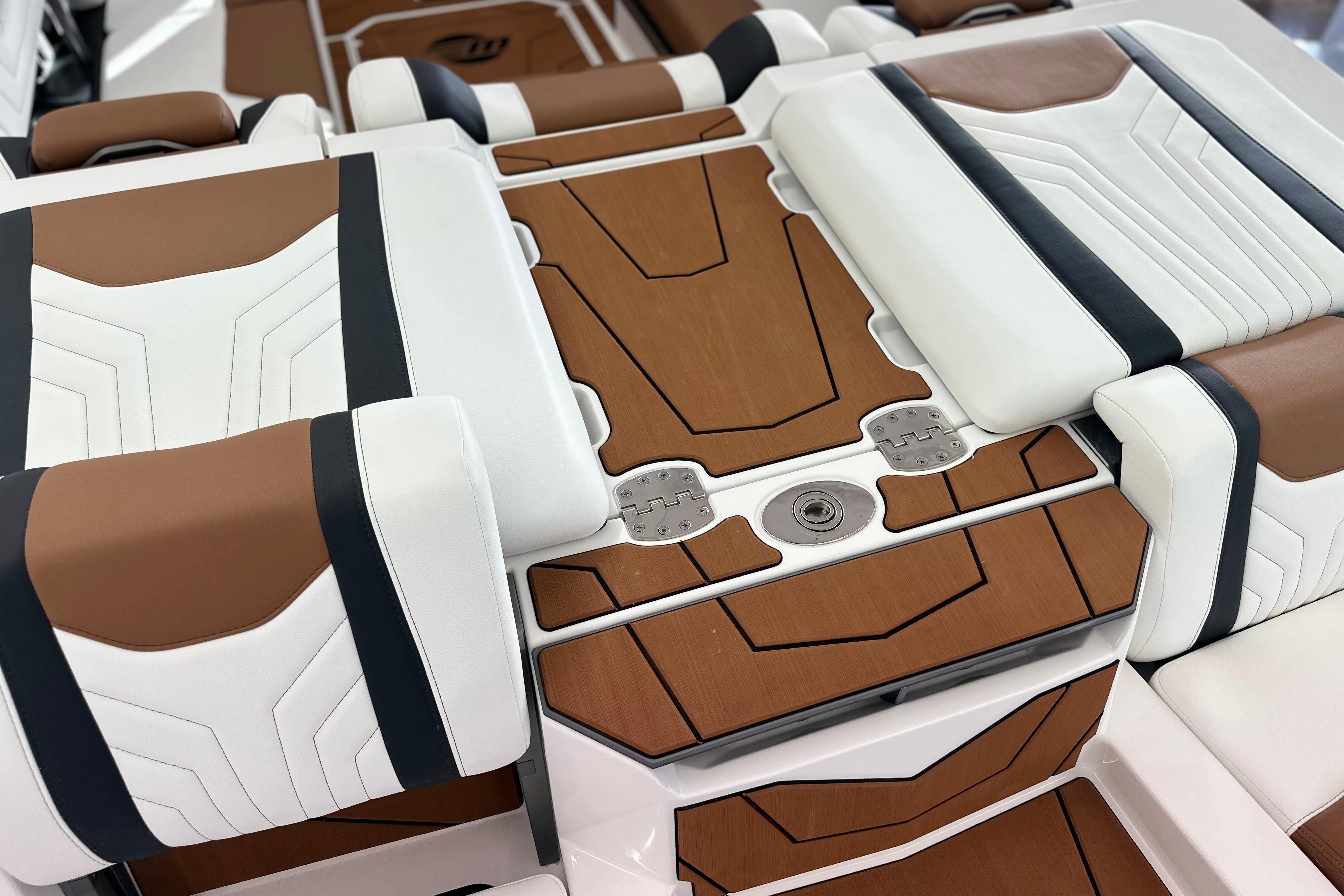 2026 Malibu Wakesetter 25 LSV interior with sleek white and brown seating design.