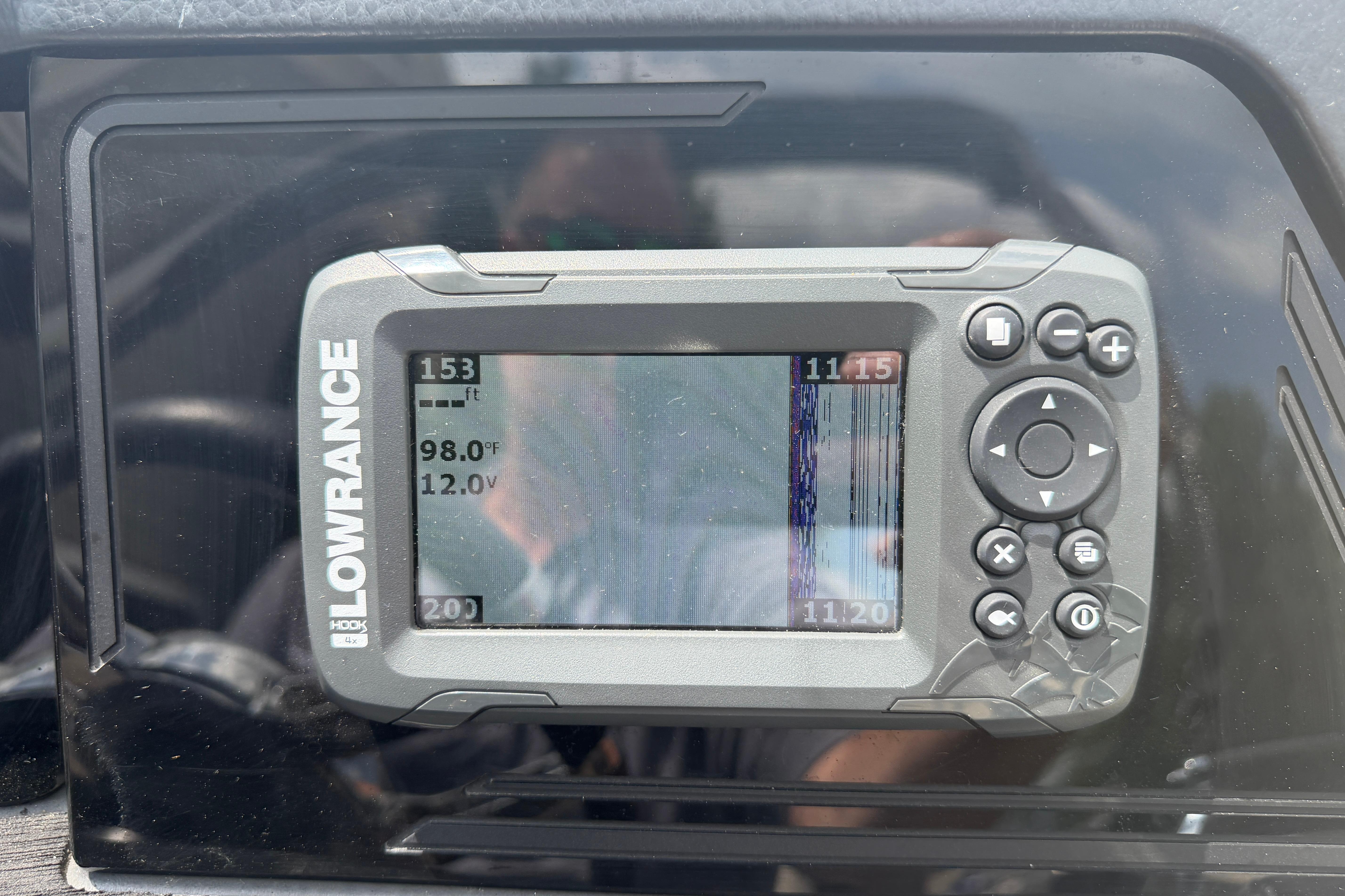 Fishfinder display on 2019 Harris Solstice 240, showing depth, temperature, and voltage readings.
