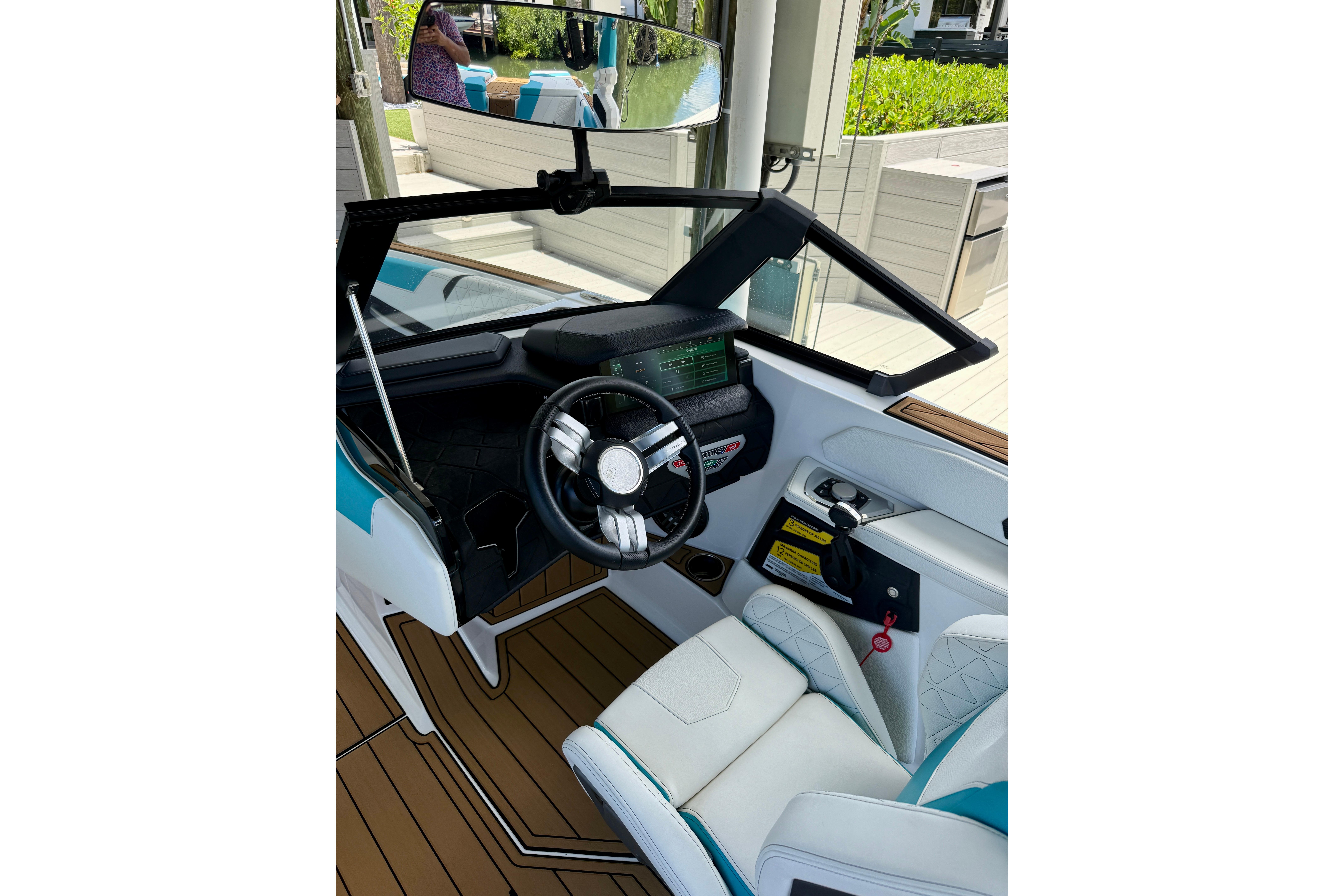 2024 Nautique Super Air Nautique GS20 cockpit with modern steering and dashboard design.