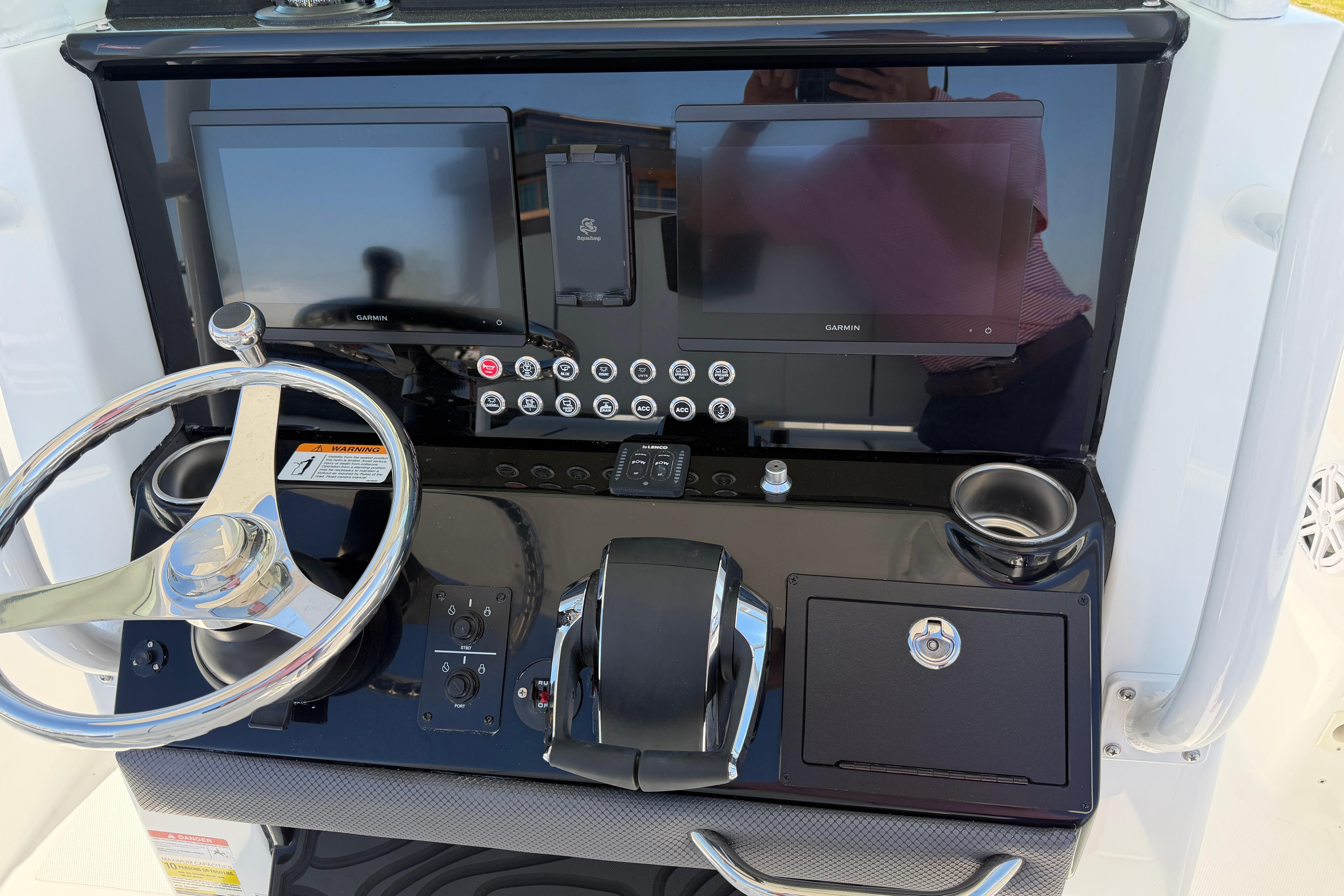Wellcraft 243 Fisherman 2026 helm with Garmin displays.