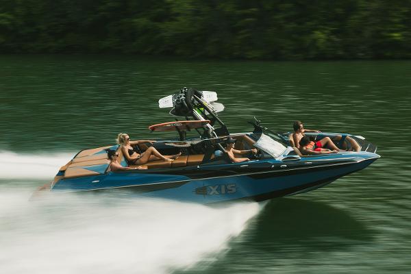 Manufacturer Provided Image: 2021 Axis A24 speedboat cruising on a lake with passengers.