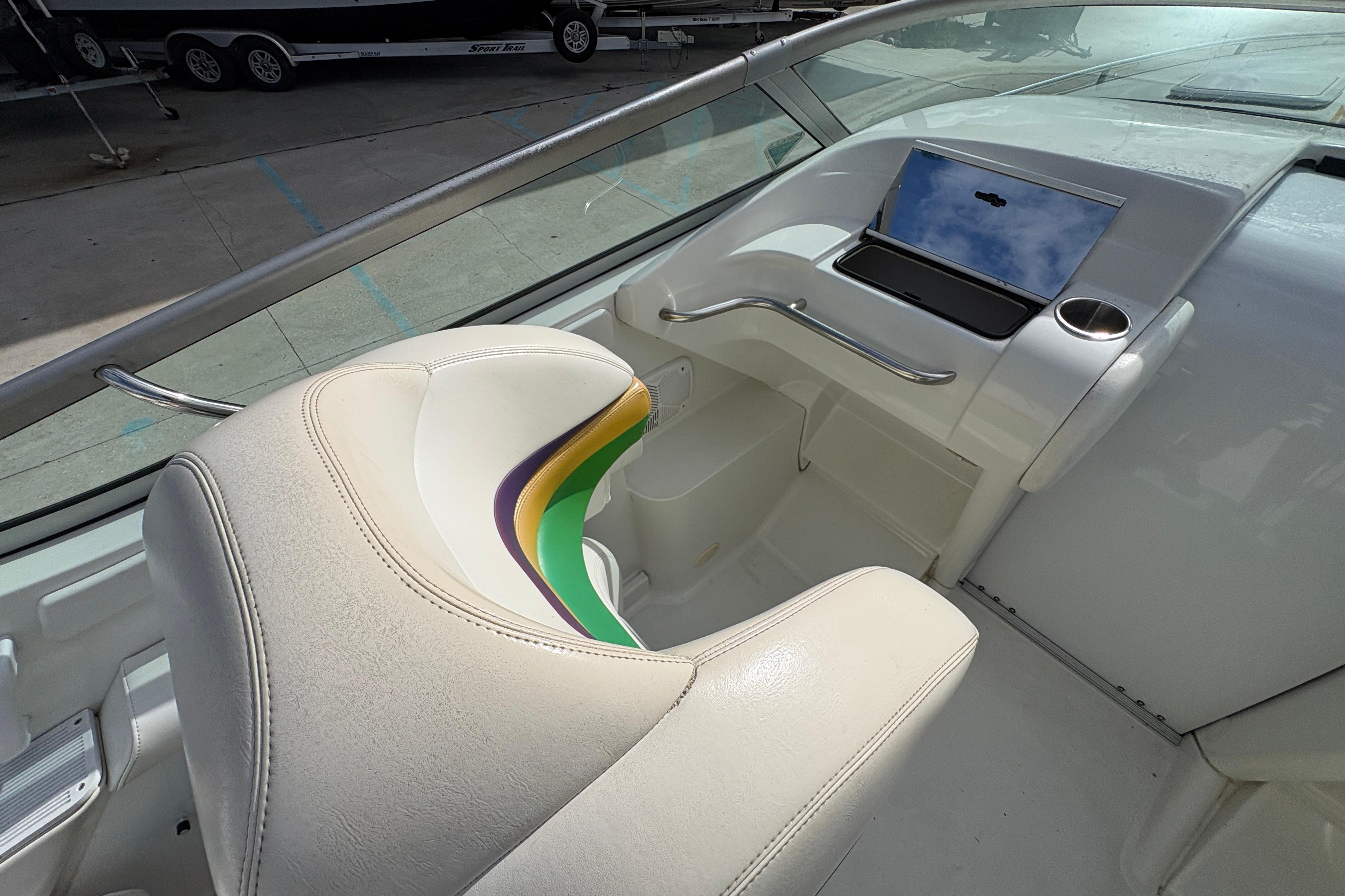 Interior of a 2002 Formula 292 FASTech boat with white seating and dashboard.