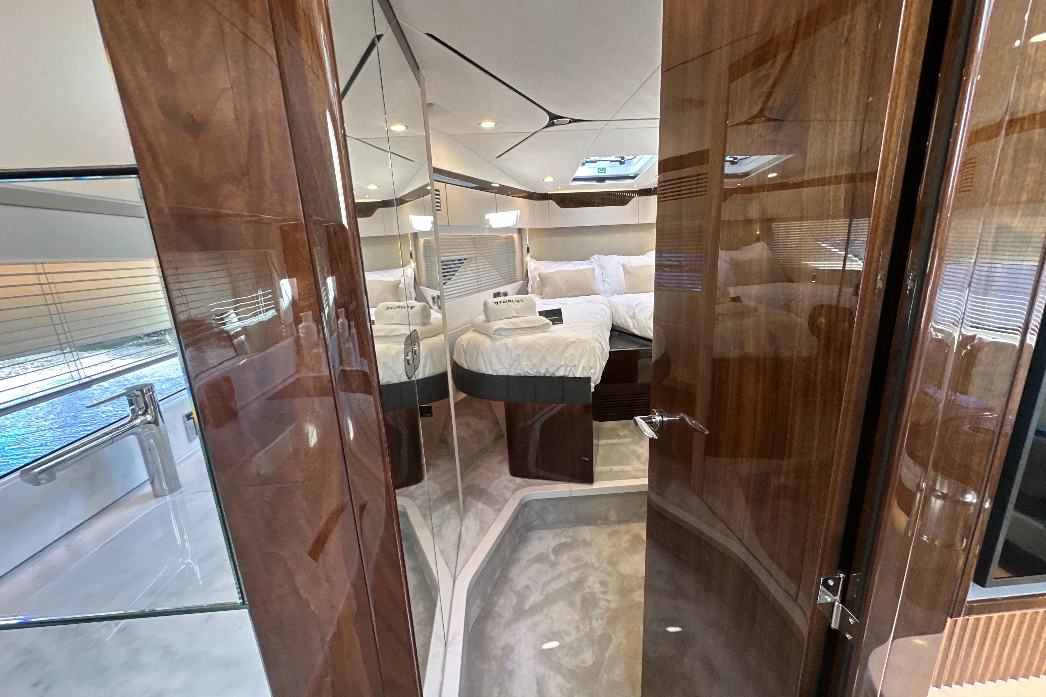 Luxurious interior of 2026 Fairline Targa 47 GT yacht with elegant wood finishes.