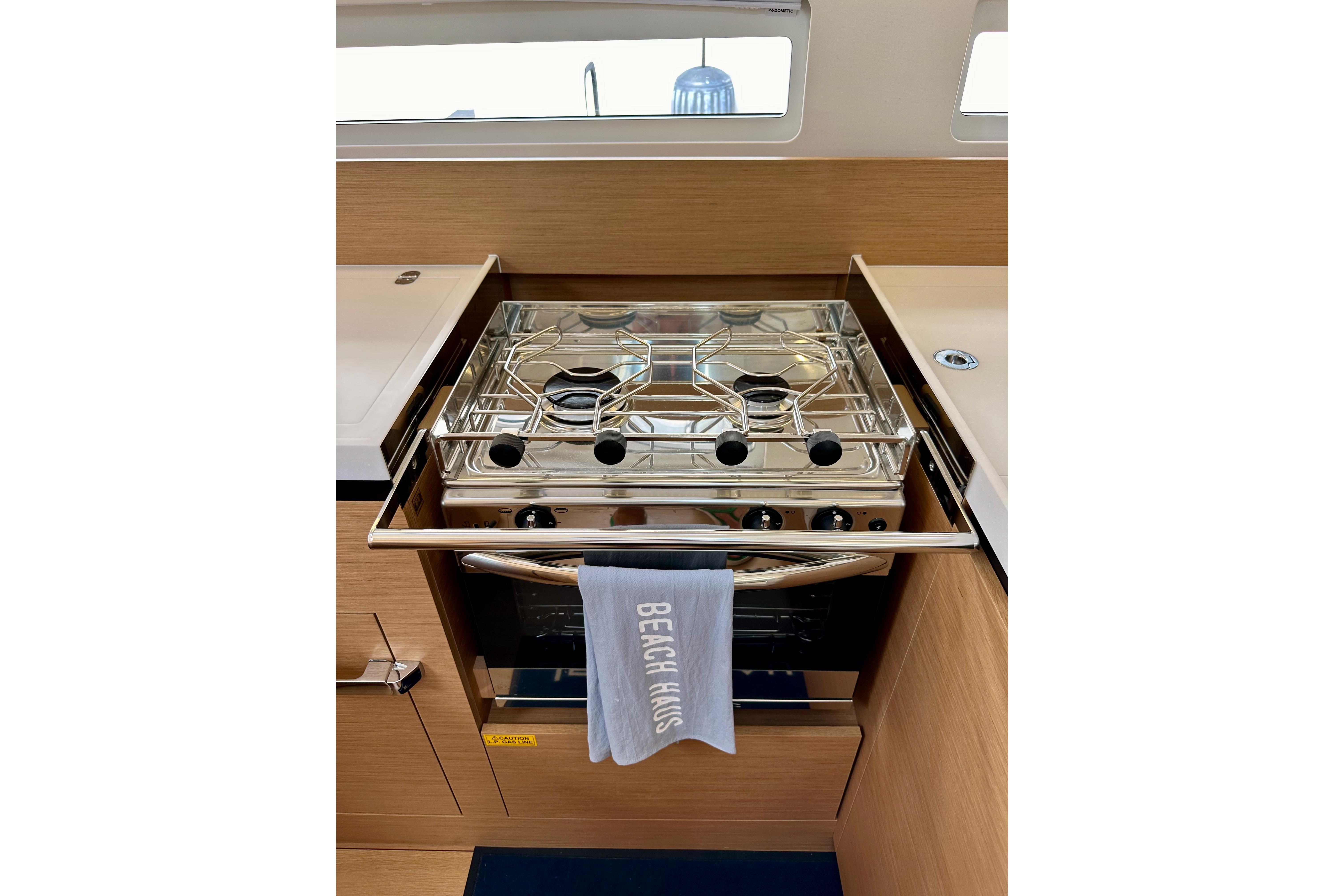 Modern kitchen stove in 2024 Jeanneau Sun Odyssey 410 yacht interior.