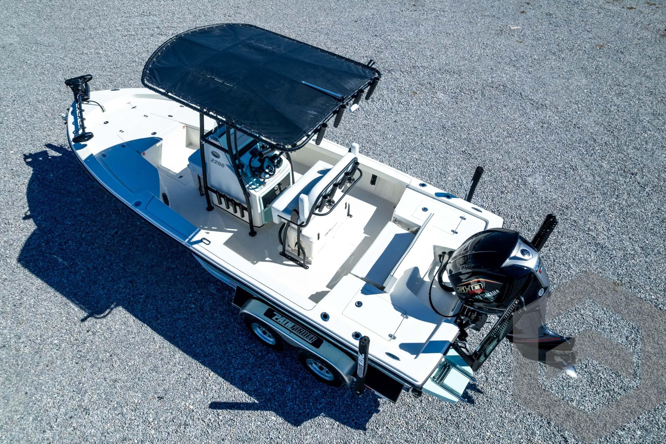 2026 Pathfinder 2200 TRS boat with canopy and outboard motor on a trailer.