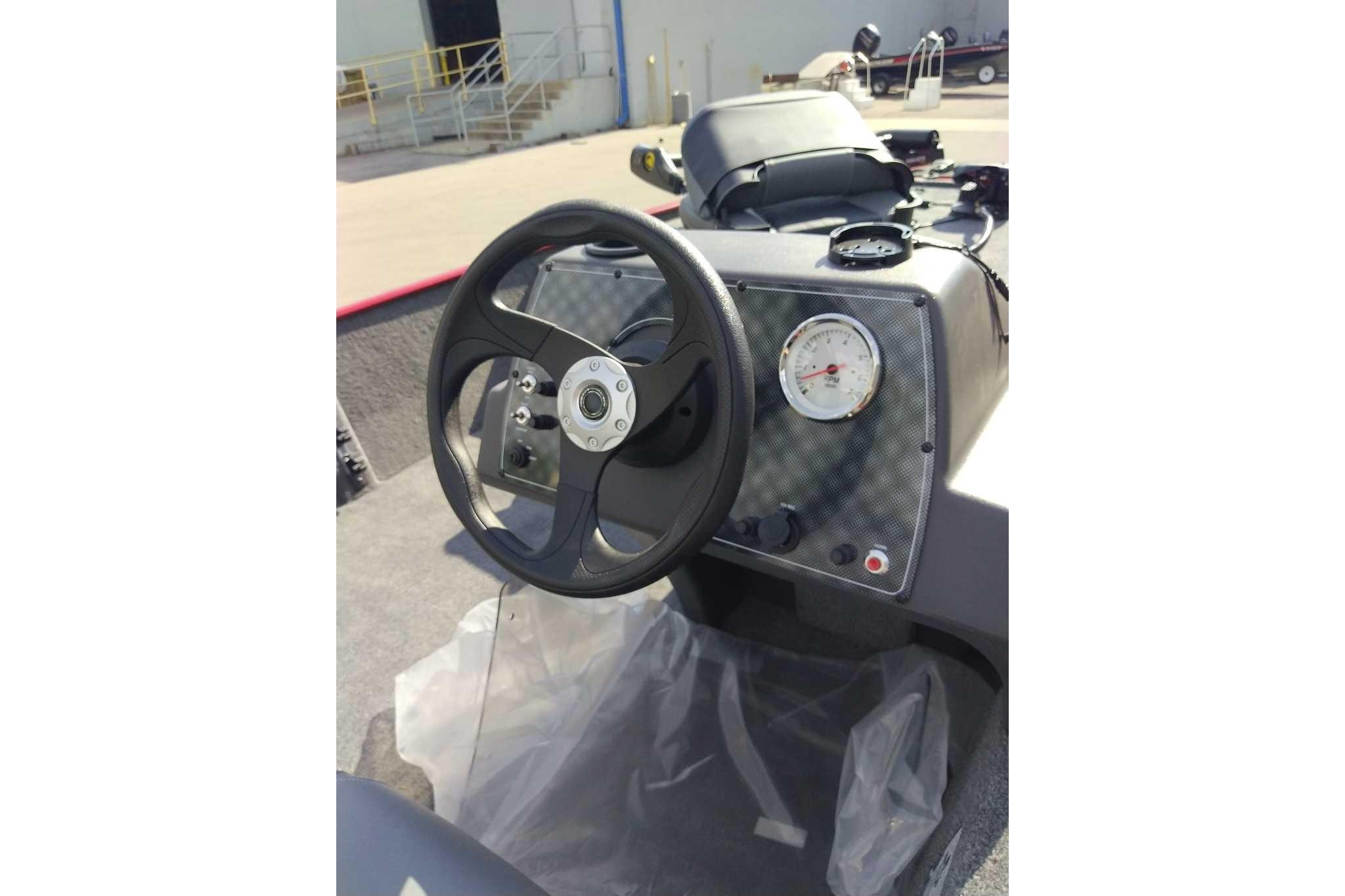 Steering console of 2026 Tracker Bass Tracker Classic XL boat, featuring a sleek design.