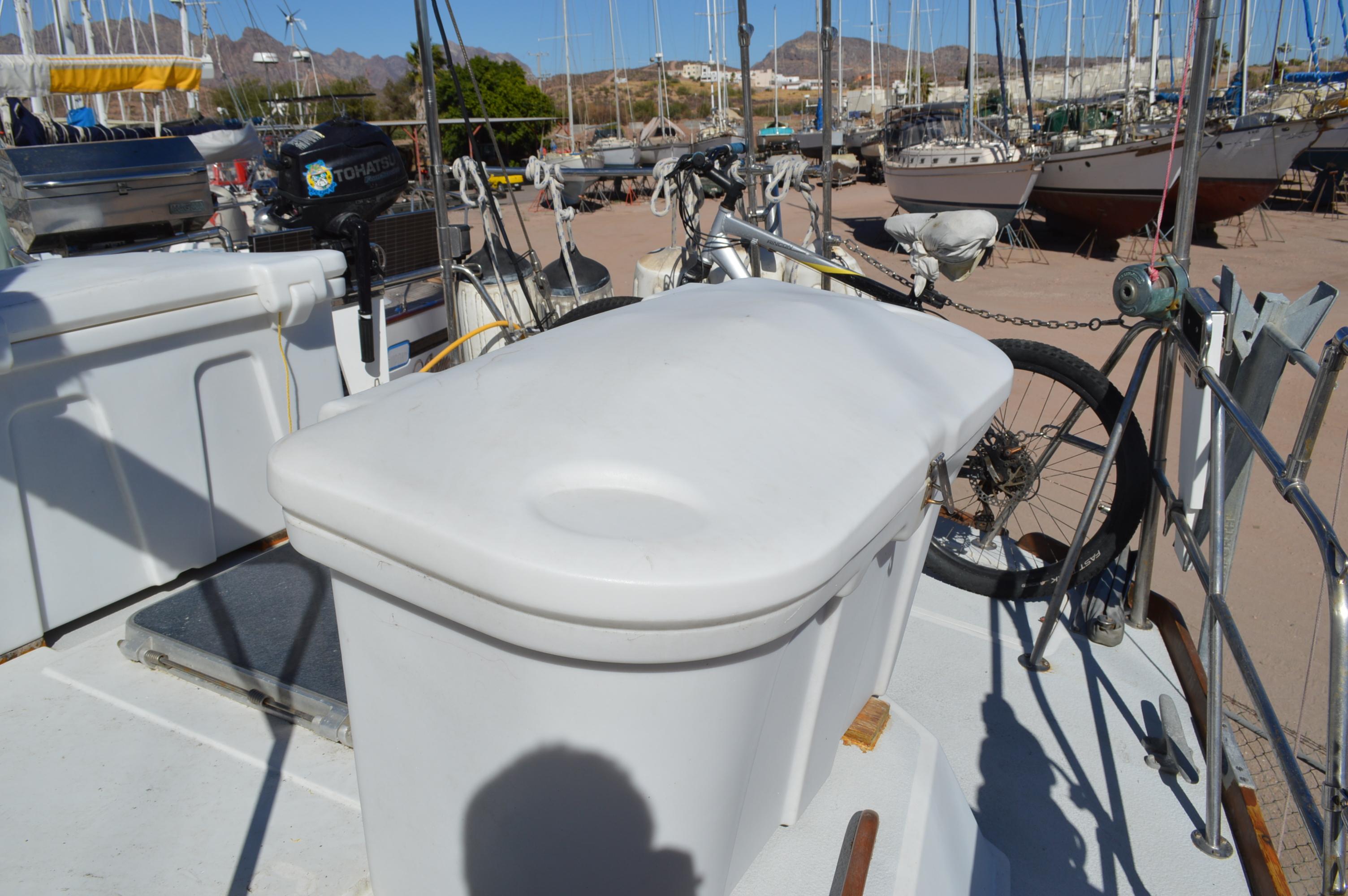 1979 Morgan 461 yacht deck with storage box and bicycles, docked at a marina.