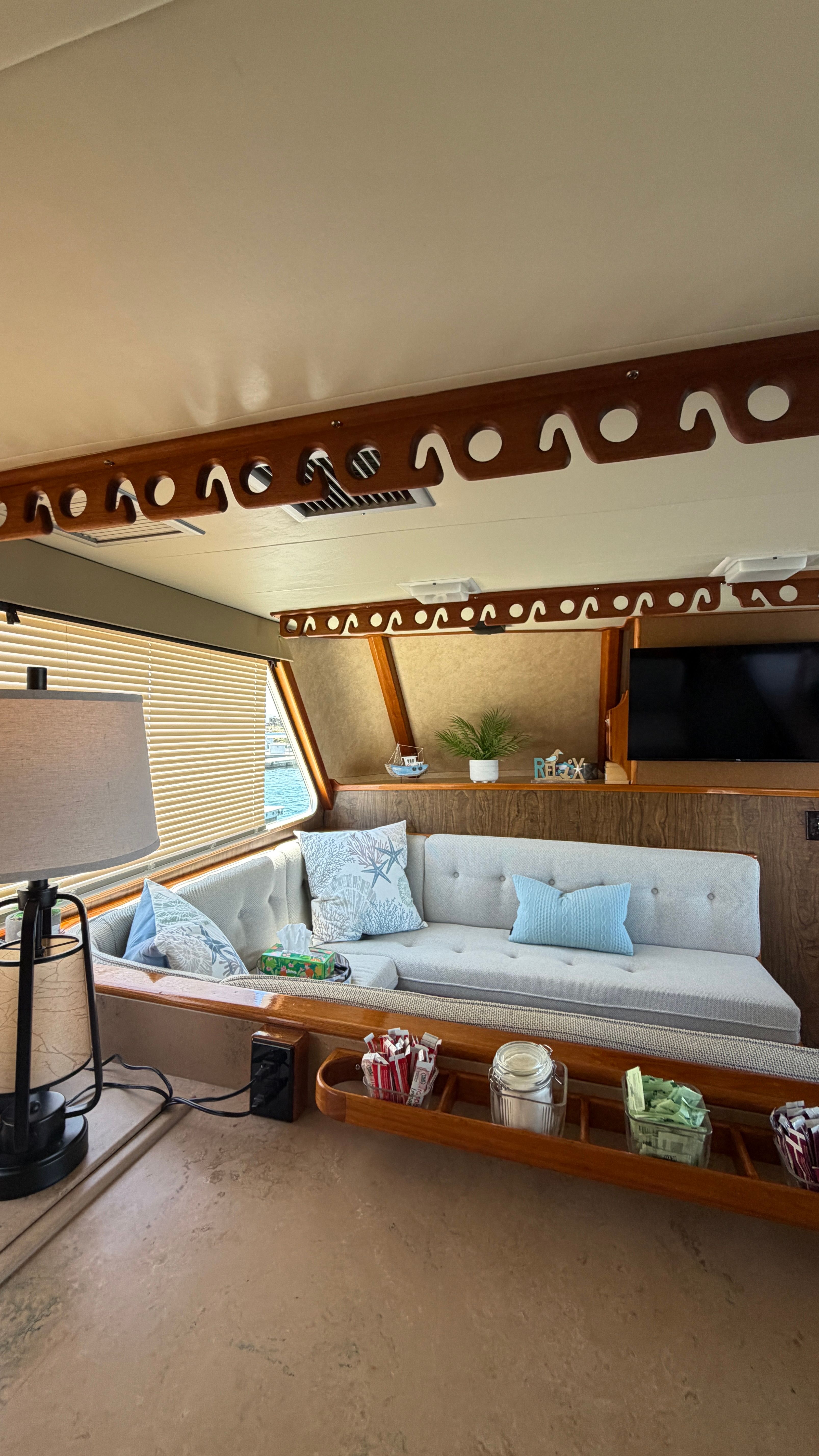 Interior of a 1966 Drake Yachtfisher with cozy seating area.