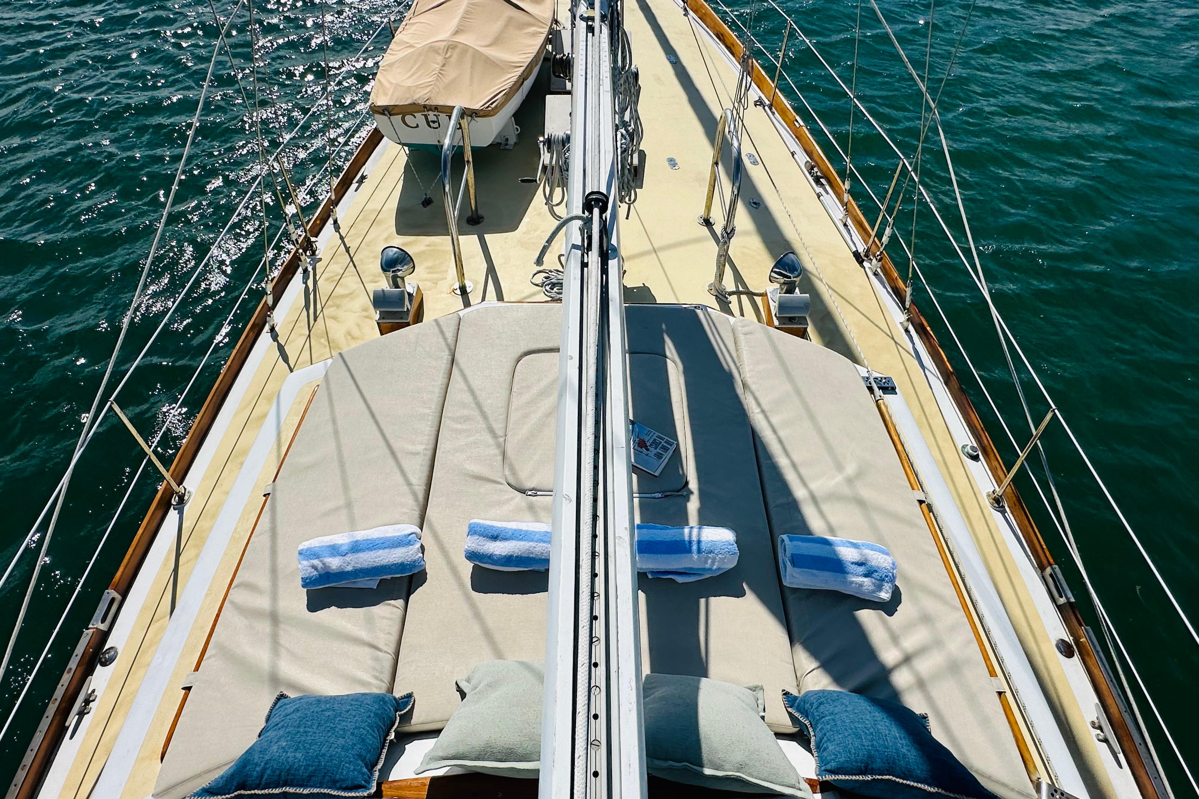 Alden Boothbay Explorer 1971 sailboat deck with cushions and towels on a sunny day.