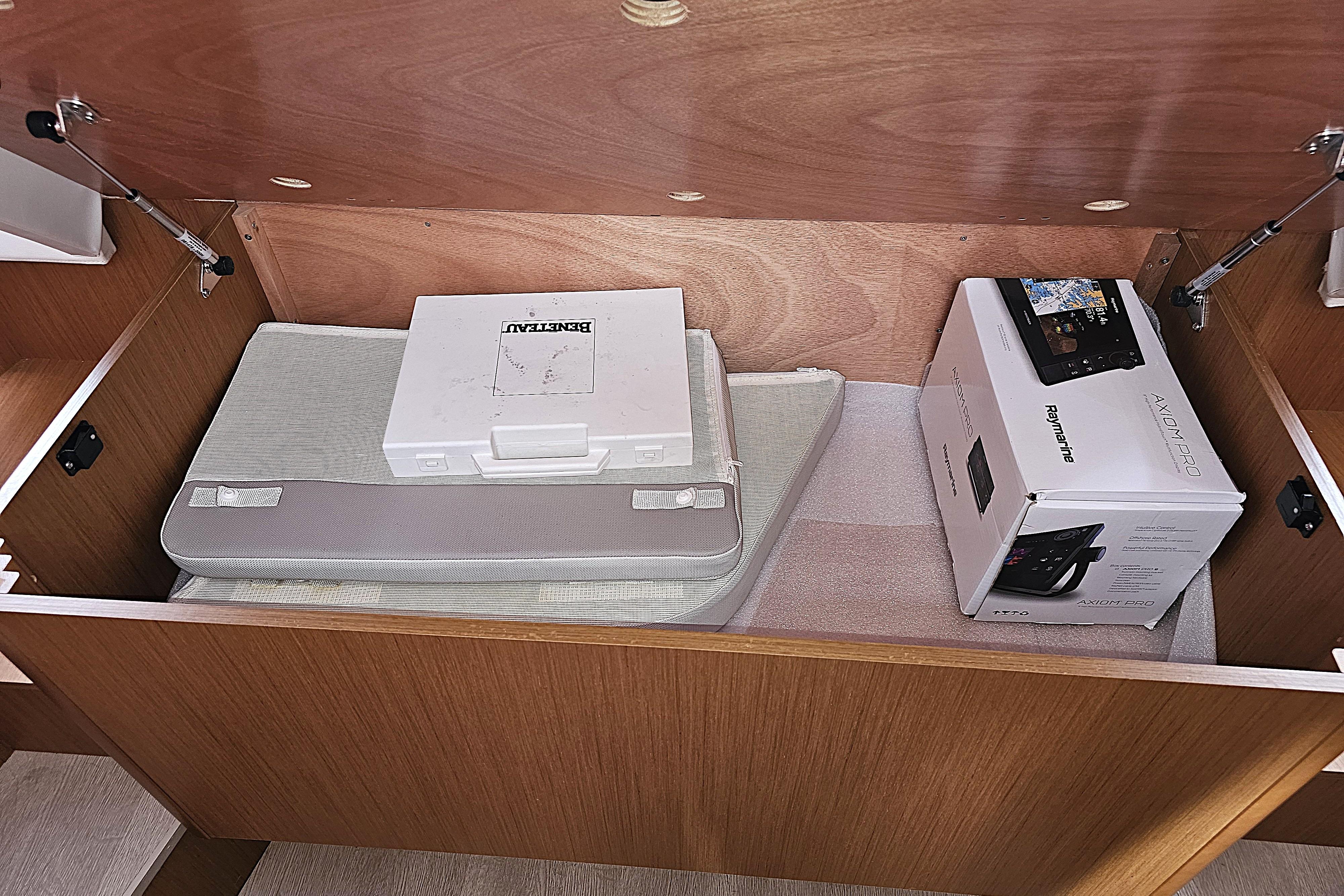 Storage compartment in a 2018 Beneteau Swift Trawler 35 with equipment boxes.