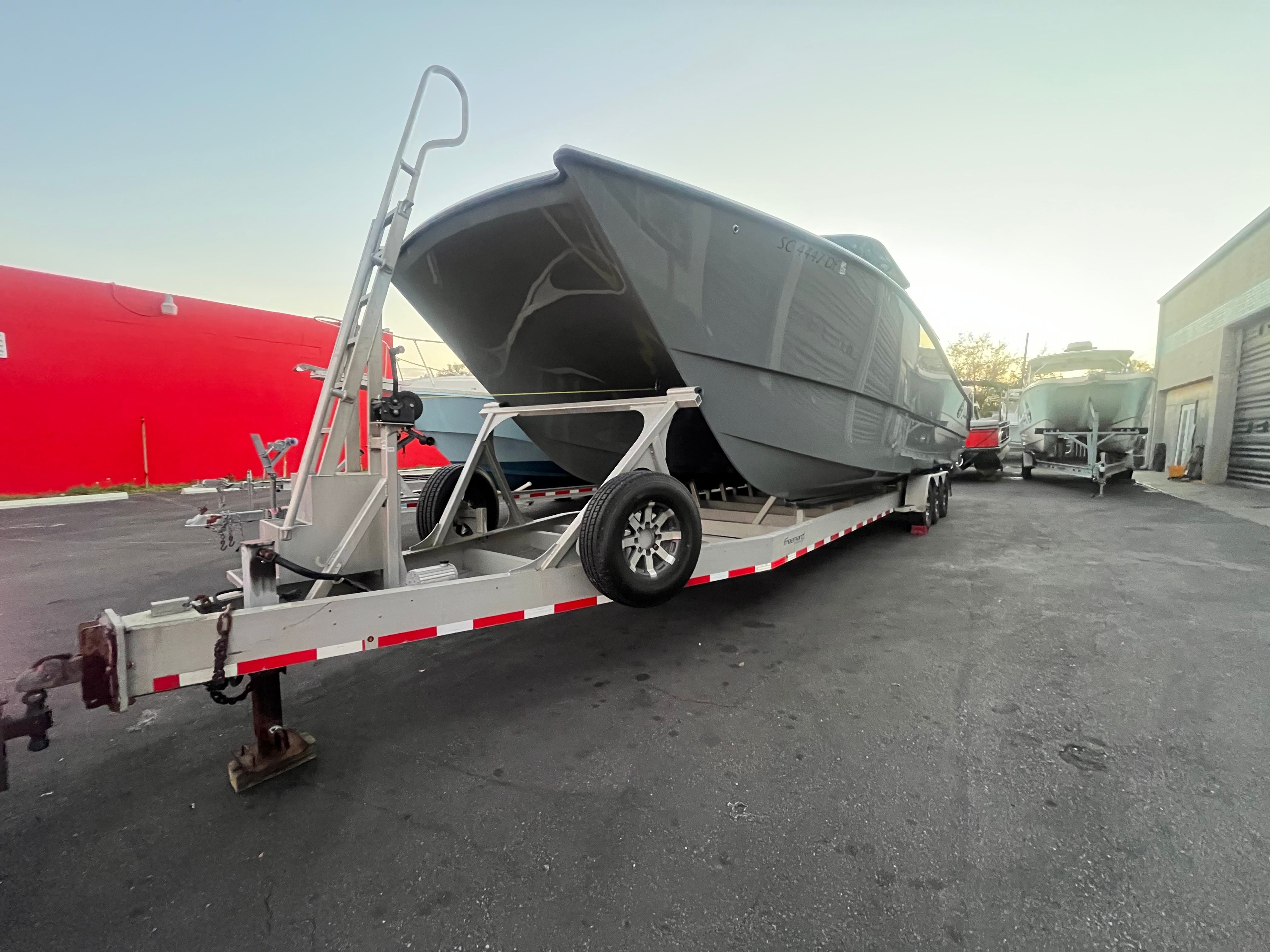 Freeman 37VH boat on trailer, 2017 model, in a storage area.