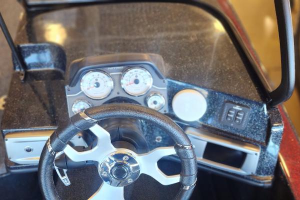 Steering wheel and dashboard of 2024 Nitro ZV21 boat, featuring modern gauges and controls.