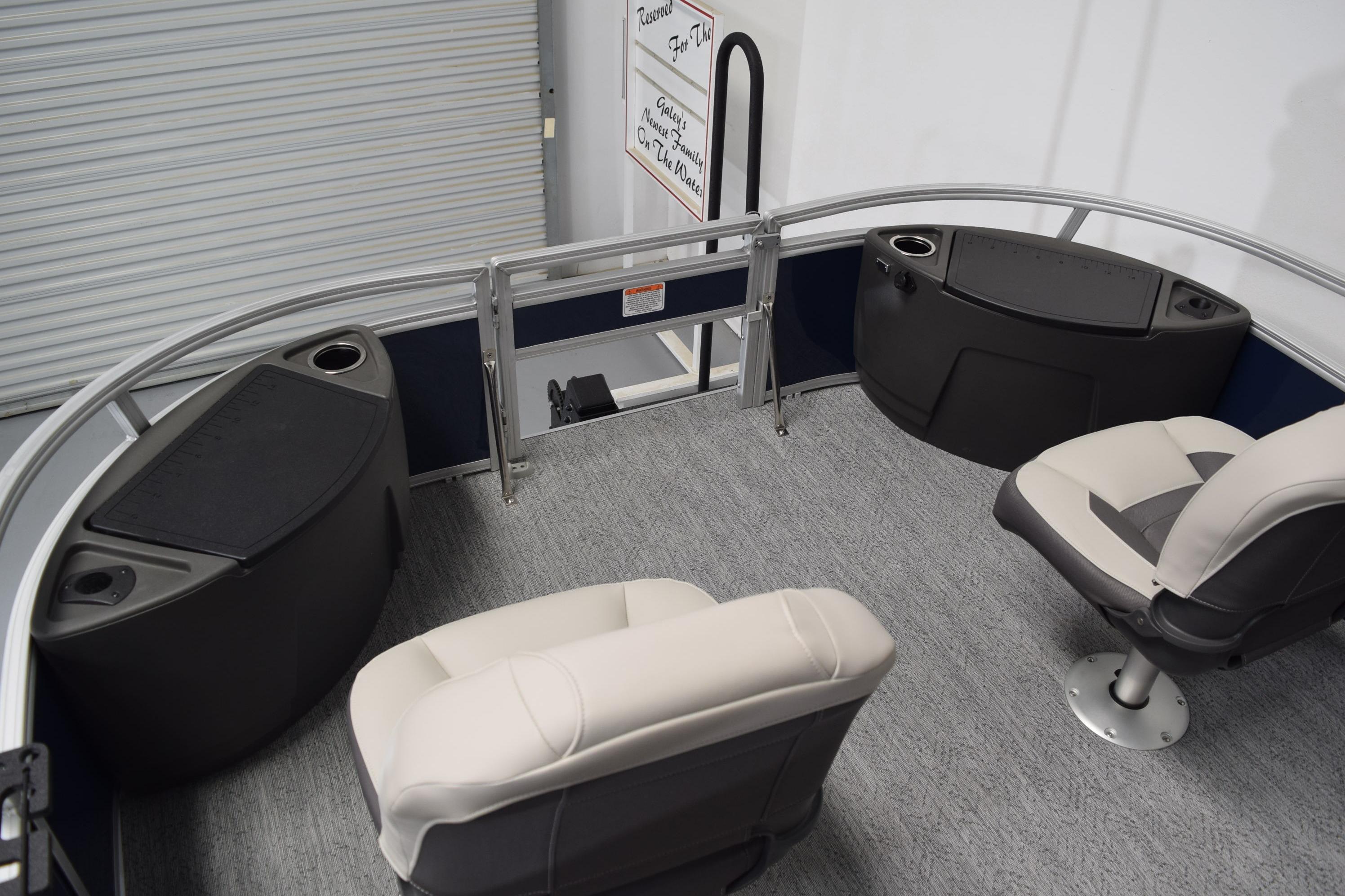 2026 Sun Tracker Bass Buggy 18 DLX interior with seating and storage compartments.