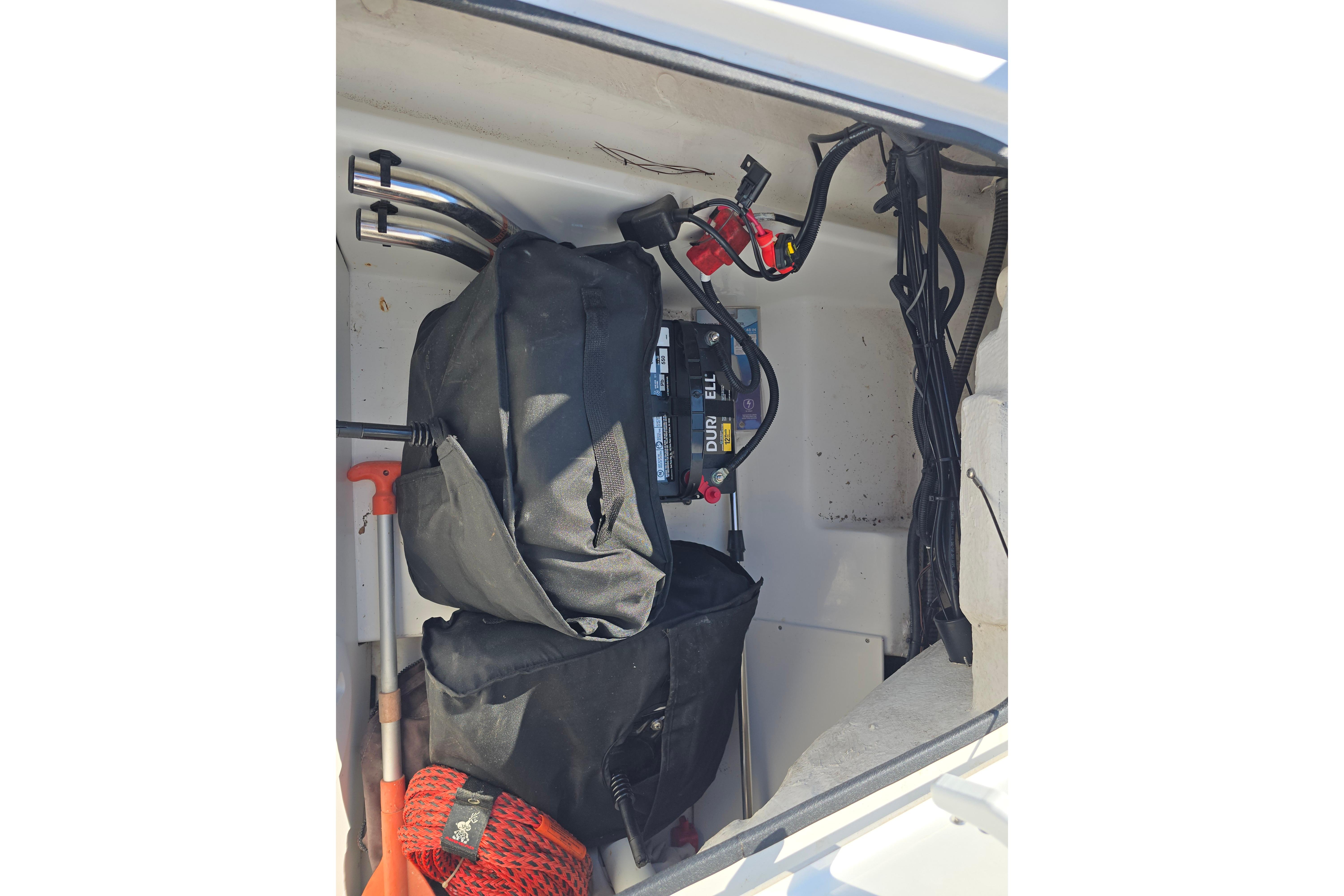 Storage compartment of 2020 Tahoe 500 TF boat with battery and equipment.