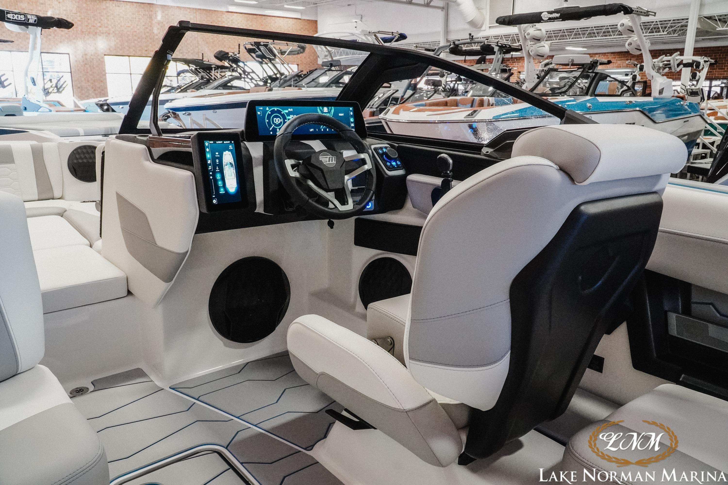 2026 Malibu Wakesetter 22 MXZ interior with modern dashboard and seating at Lake Norman Marina.