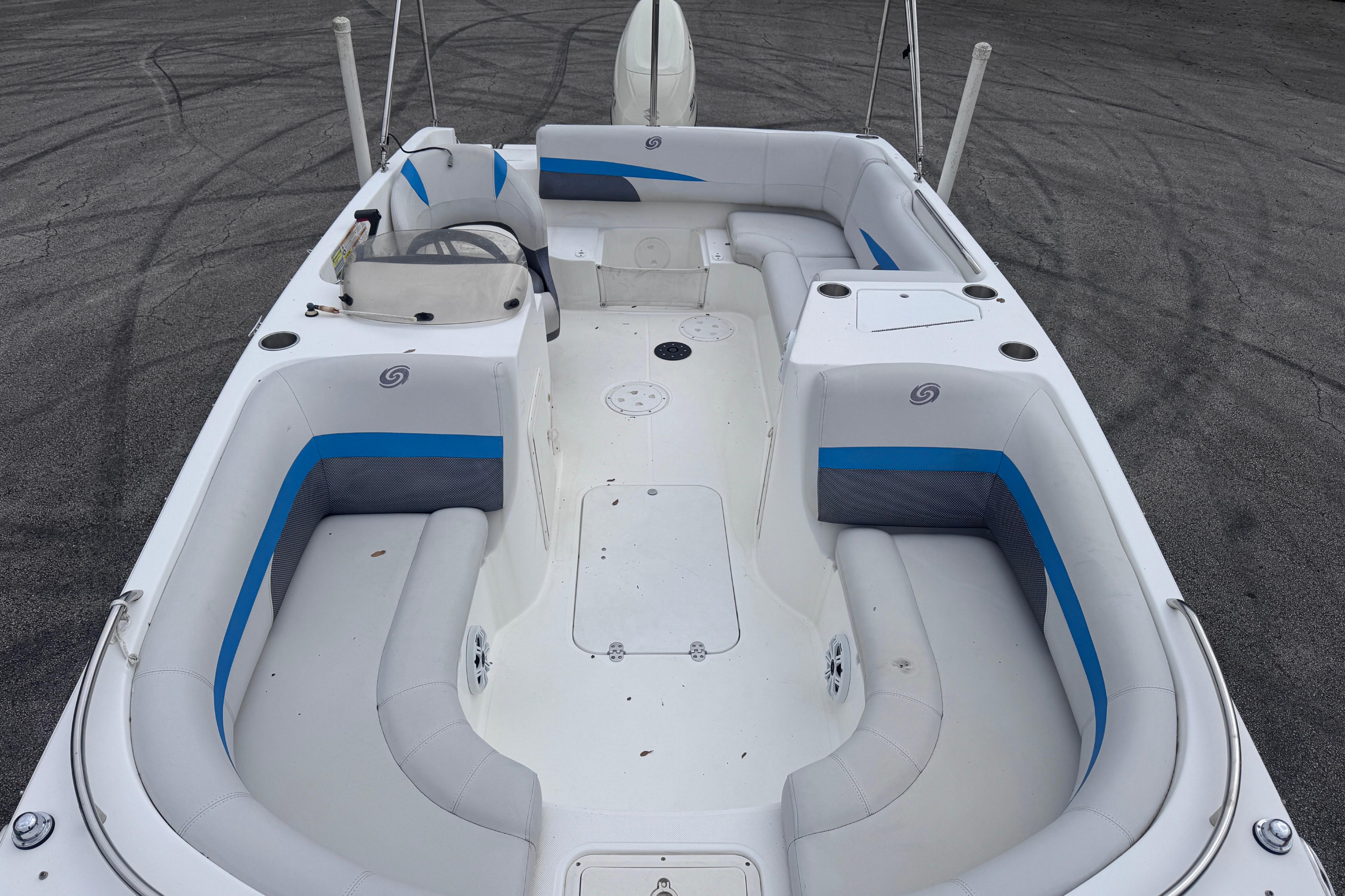 2018 Hurricane SunDeck Sport 188 OB boat interior with spacious seating and steering console.