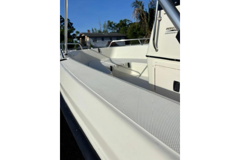 2005 Hydra-Sports Lightning 180 CC boat interior with railing and console, sunny day.