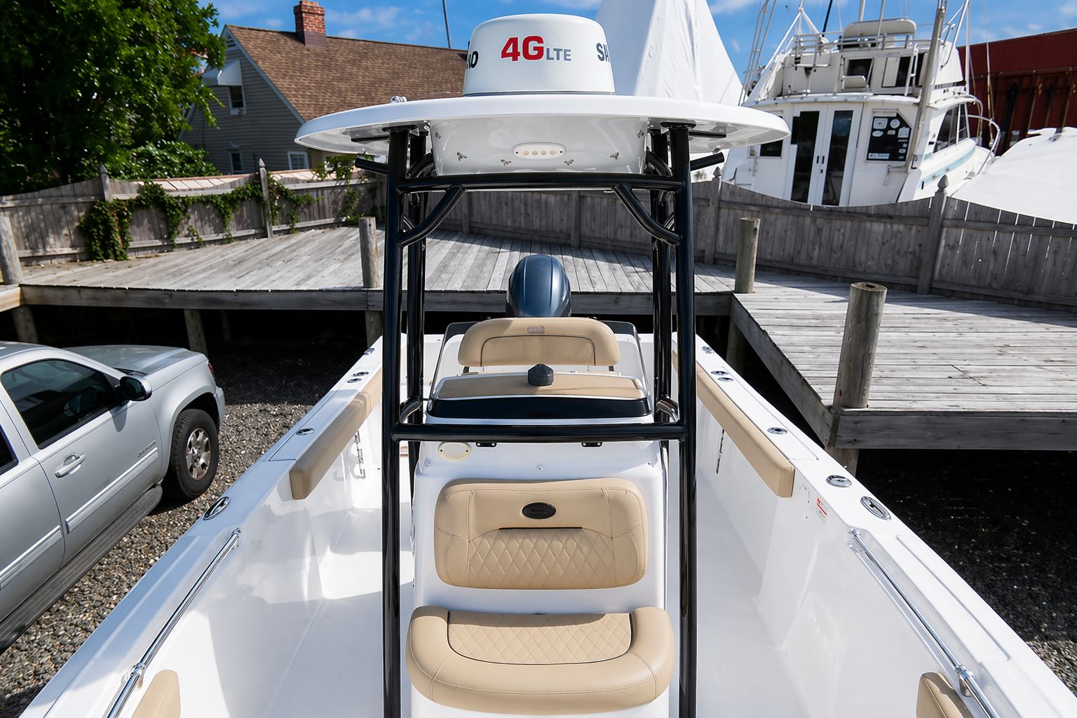 2018 Sportsman Heritage 231 Center Console boat at dock.