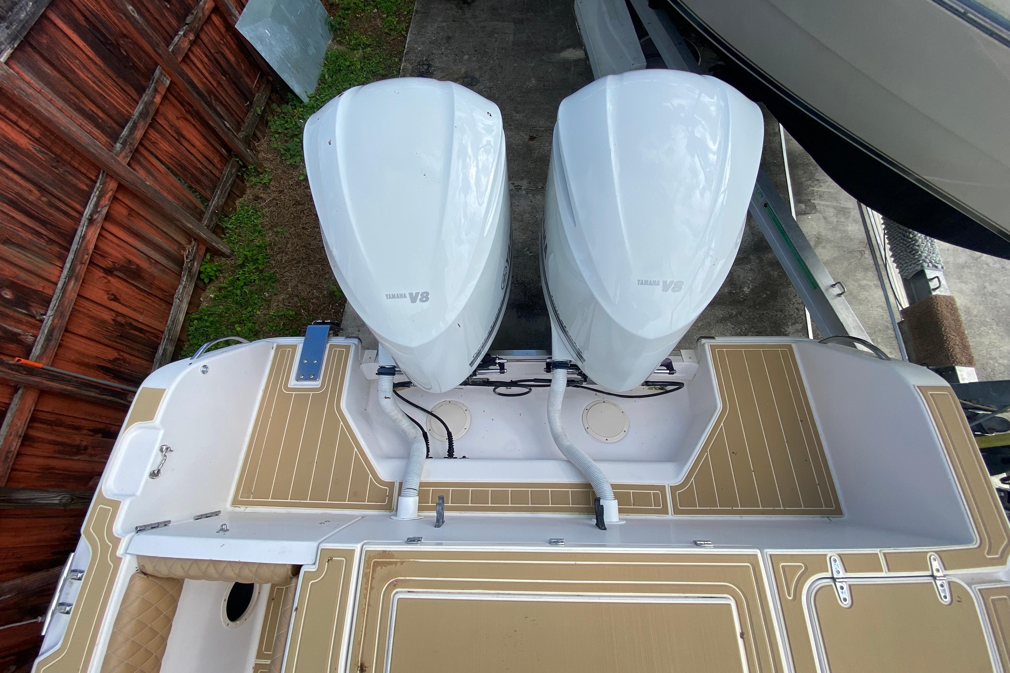 Top view of 2004 Grady-White Canyon 283 boat with twin Yamaha V8 engines.