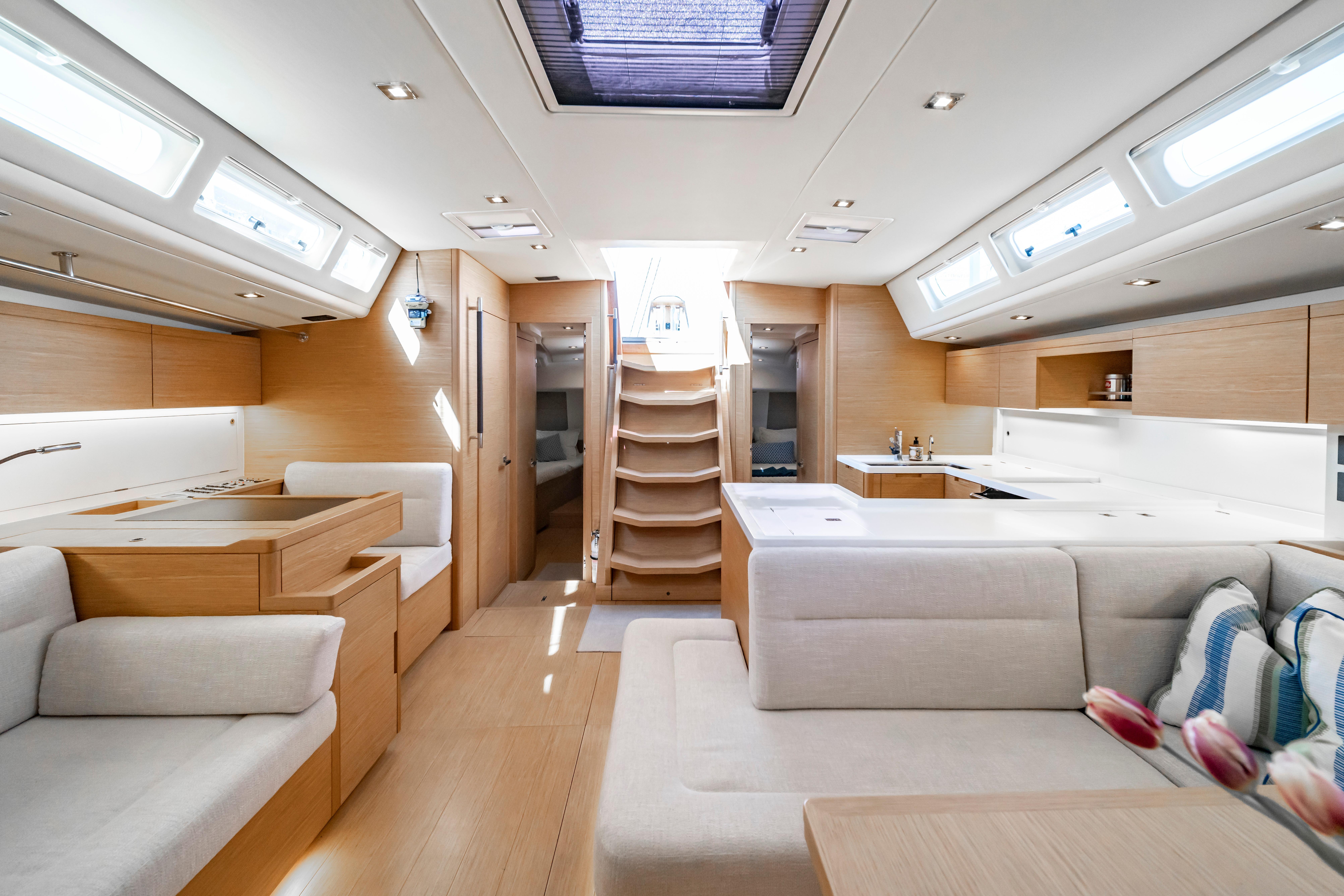 Luxurious interior of 2016 Grand Soleil 58 yacht with modern design and ample natural light.