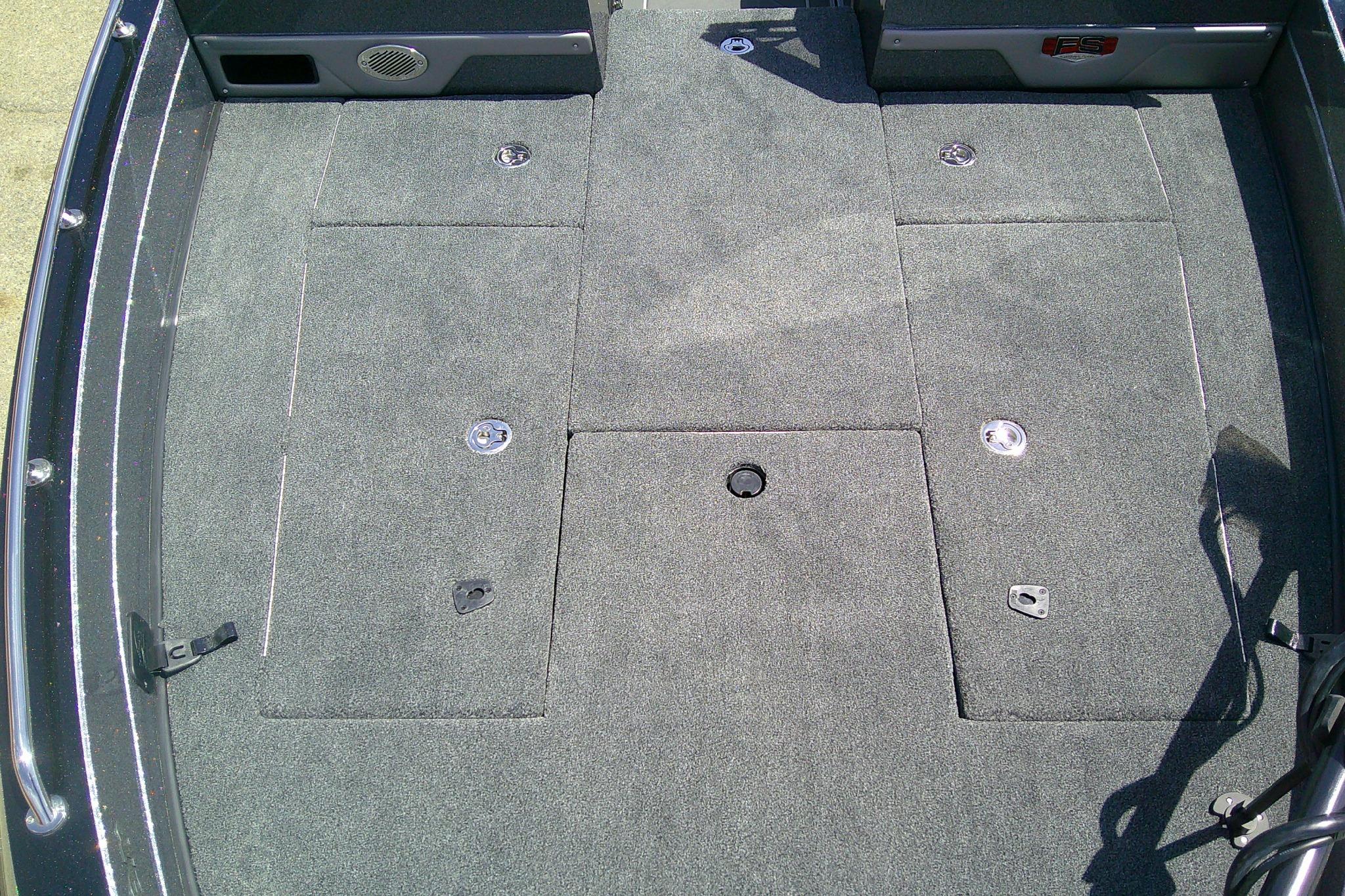 Carpeted deck of 2026 Ranger 620FS Cup-Equipped boat with storage compartments.