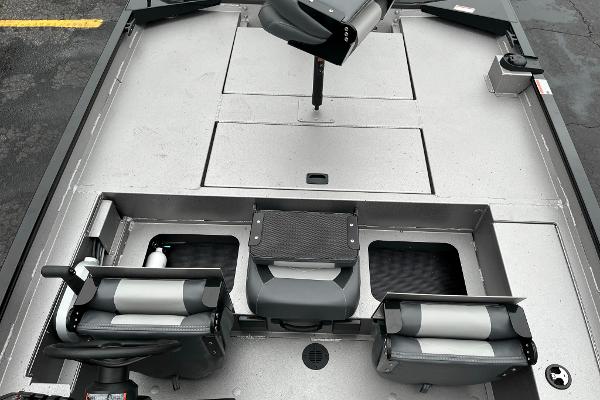 2024 Lowe Legacy boat interior with seating and storage compartments.